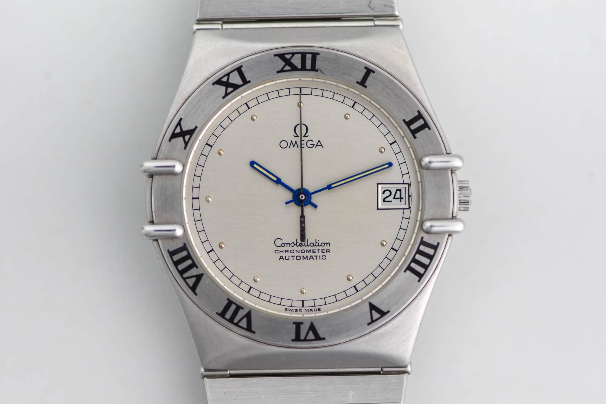 May be an image of wrist watch and text that says 'XI XIII I XII X X ٥ ر OMEGA GA OM n ٥ 2 24 Constelation CHRON CHRONOMETER CHR AUTOMATIC AUT 2 ® VIIII G 0 n E ® TII JIII SWISS…