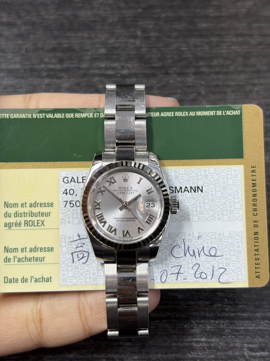 May be an image of wrist watch and text