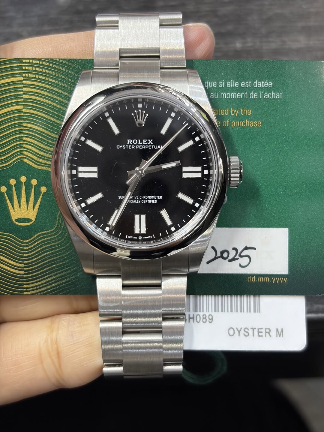 May be an image of wrist watch and text that says '我業信画 番加教城新生 que si elle est datée au moment de achat ted by the of purchase ROLEX EX OYSTER PERPETU TUA Il SUP CHRONOMETER…