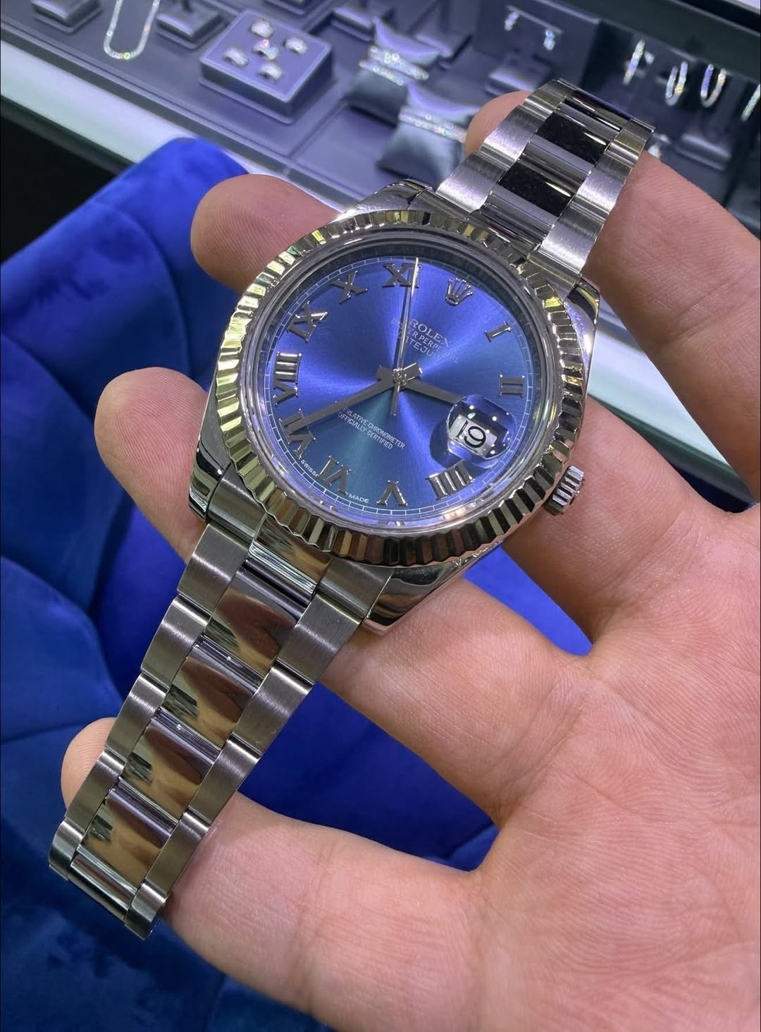 May be an image of wrist watch and text