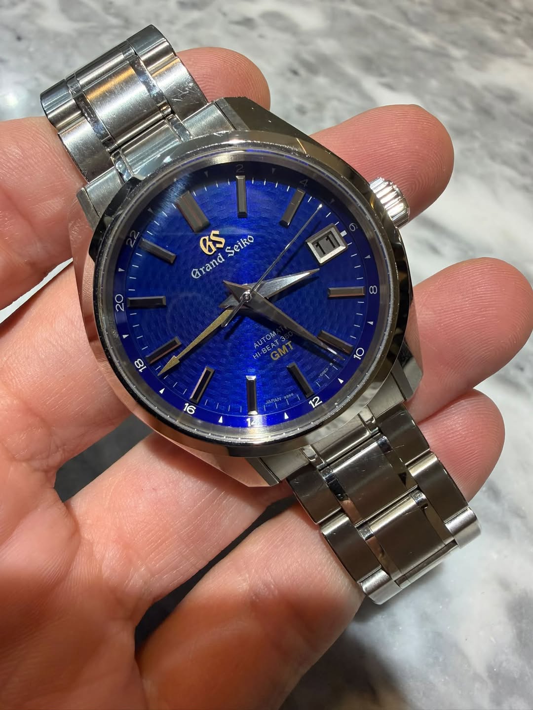 May be an image of wrist watch and text