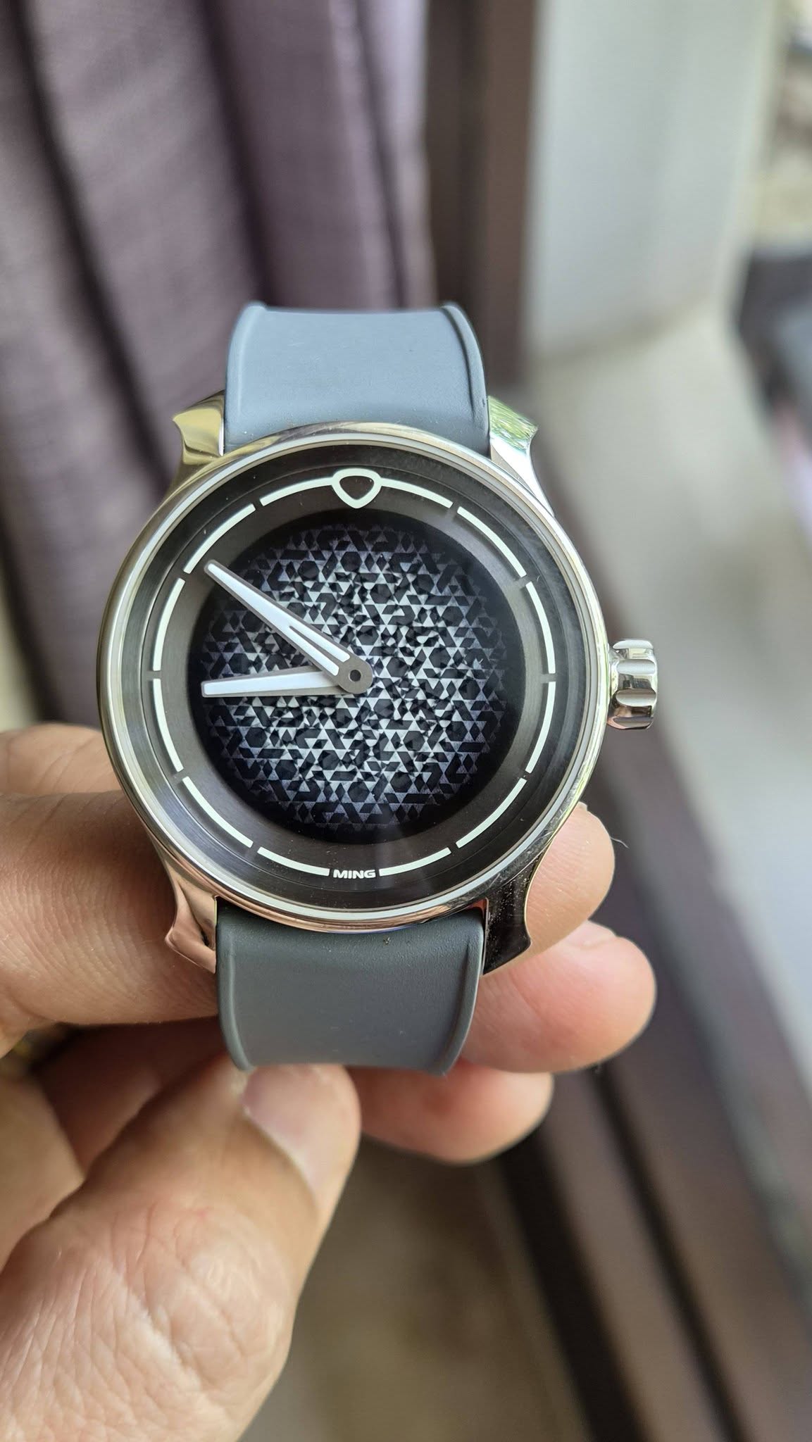 May be an image of digital watch and text that says 'MING MIN'