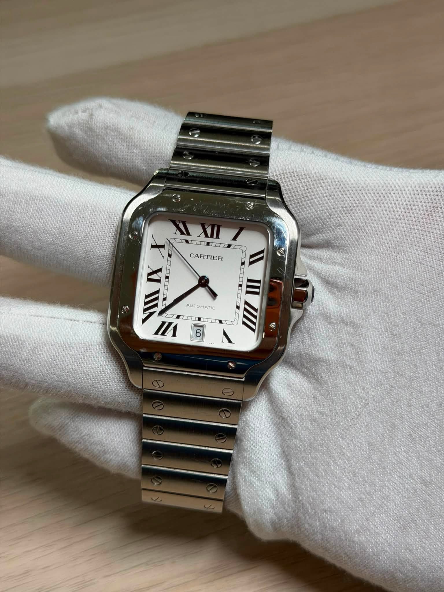 May be an image of wrist watch and text