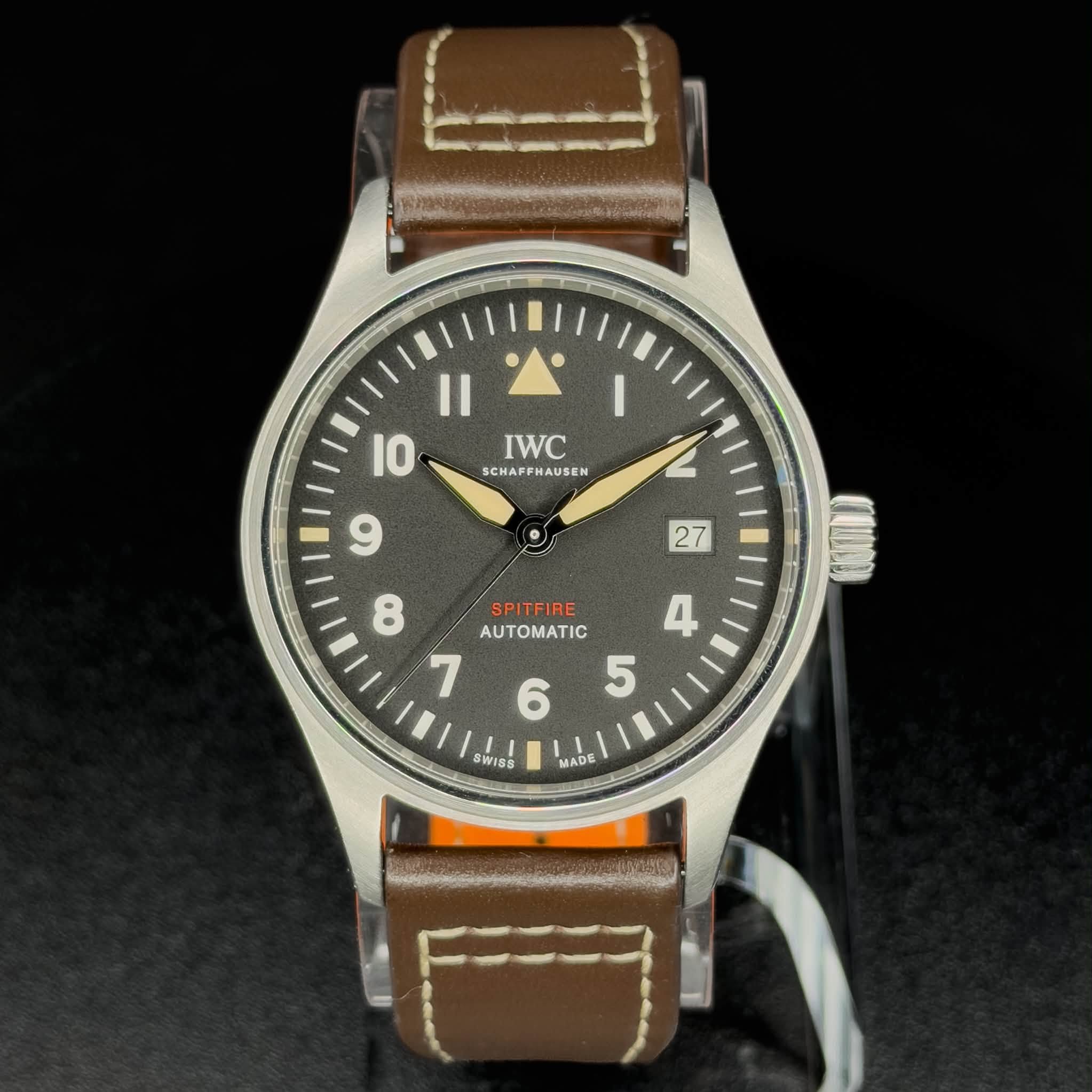 May be an image of wrist watch and text that says '• IWC SCHAFFHAUSEN AUSEN SCHAFF 2 27 I0 و 8 SPITFIRE SPIT AUTOMATIC 4 ۲ 6 5 SWISS MADE ADE'