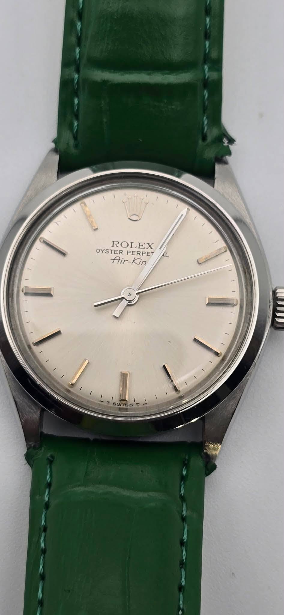 May be an image of wrist watch and text that says '0 OYSTERERPET ROL ROLEX EX OYSTER PERPET PET L frir-Kin fhir Kin WU'