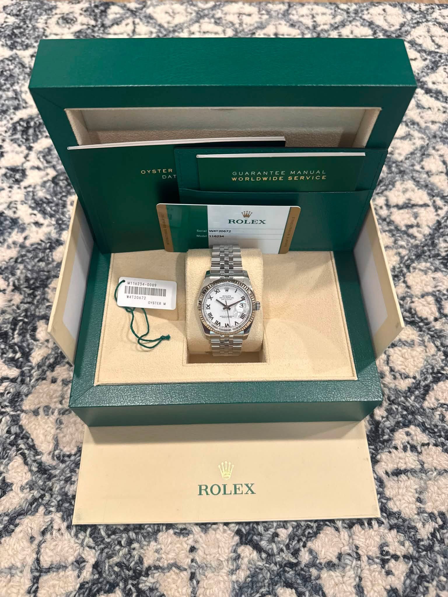 May be an image of wrist watch and text