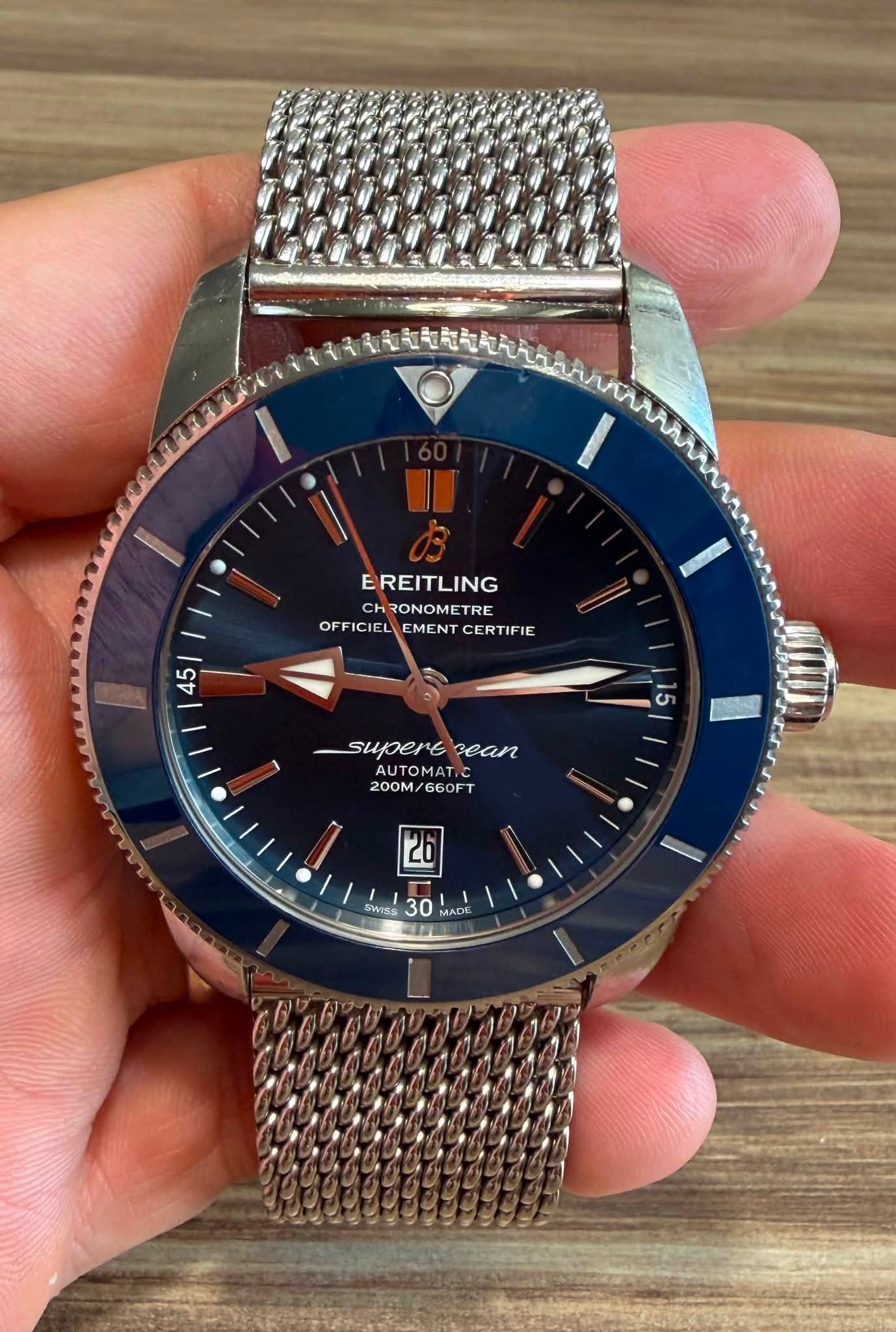 May be an image of wrist watch and text that says 'EREITLING RONOME CHRONOMETRE TRE OFFICIEL OFFICIELEMENTCERTIFIE OFF EMENT CERTIFIE 5 45 5 superecean supere Bean AUTOMAT.O 200M…