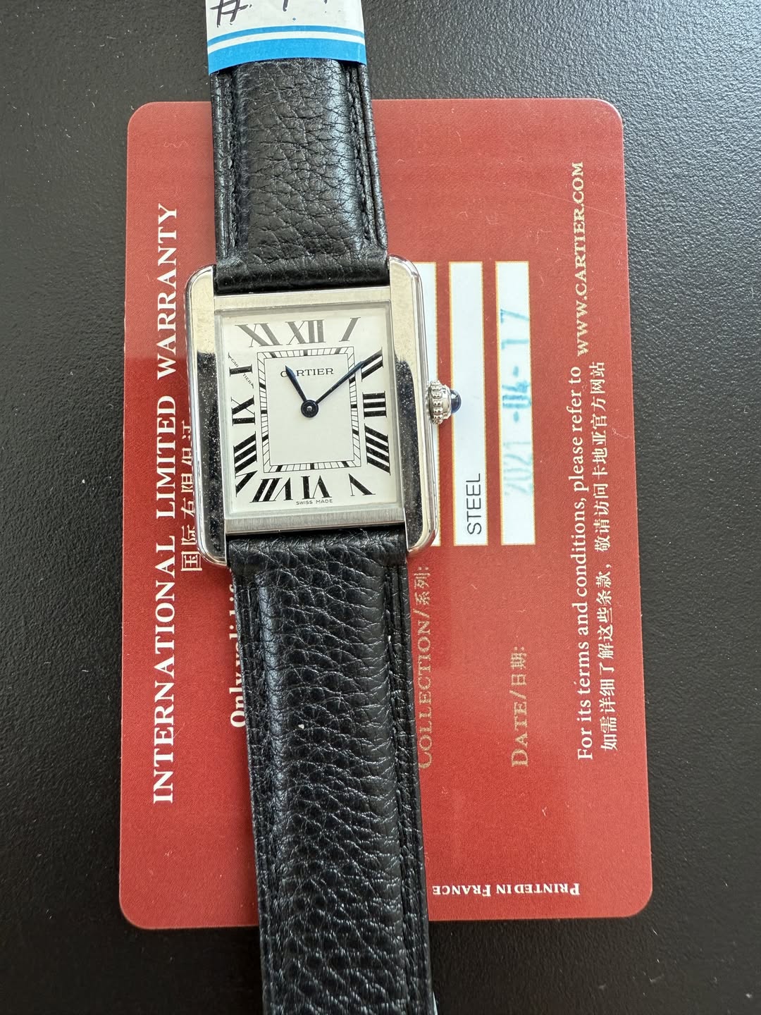 May be an image of leather, digital watch and text that says 'III L אן WARRANTY XI XI ह (고파니 圖 IL RTIER LIMITED 金照织灯 右姐年 IX RD NTERNATIONAL INTERN 国际 Onlusali1s A 口間 5: nЛΙA…