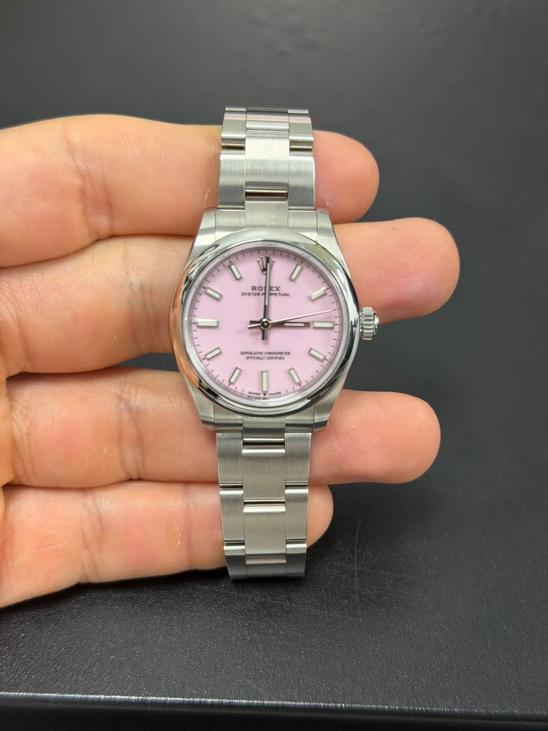 May be an image of wrist watch and text