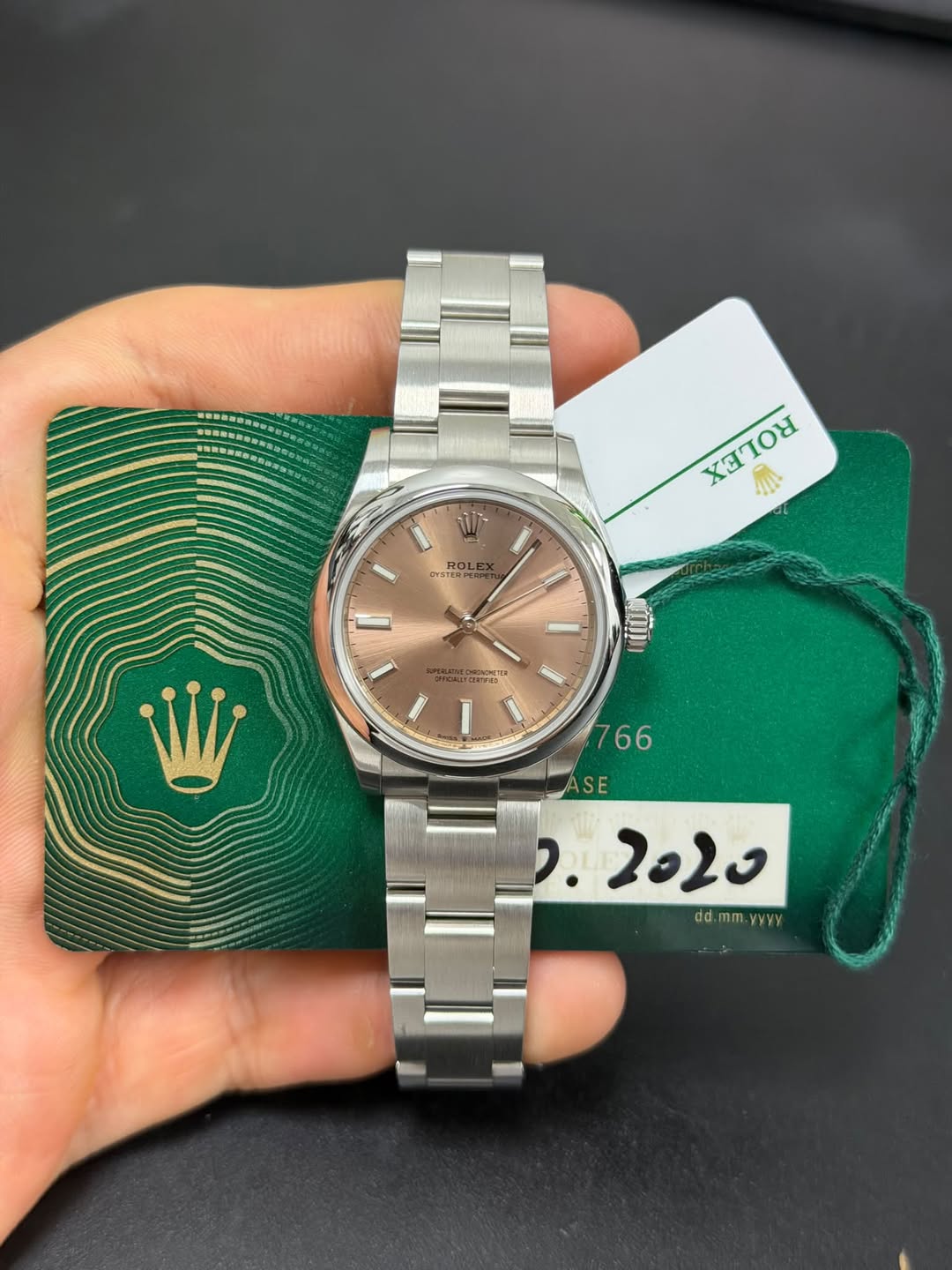 May be an image of wrist watch and text