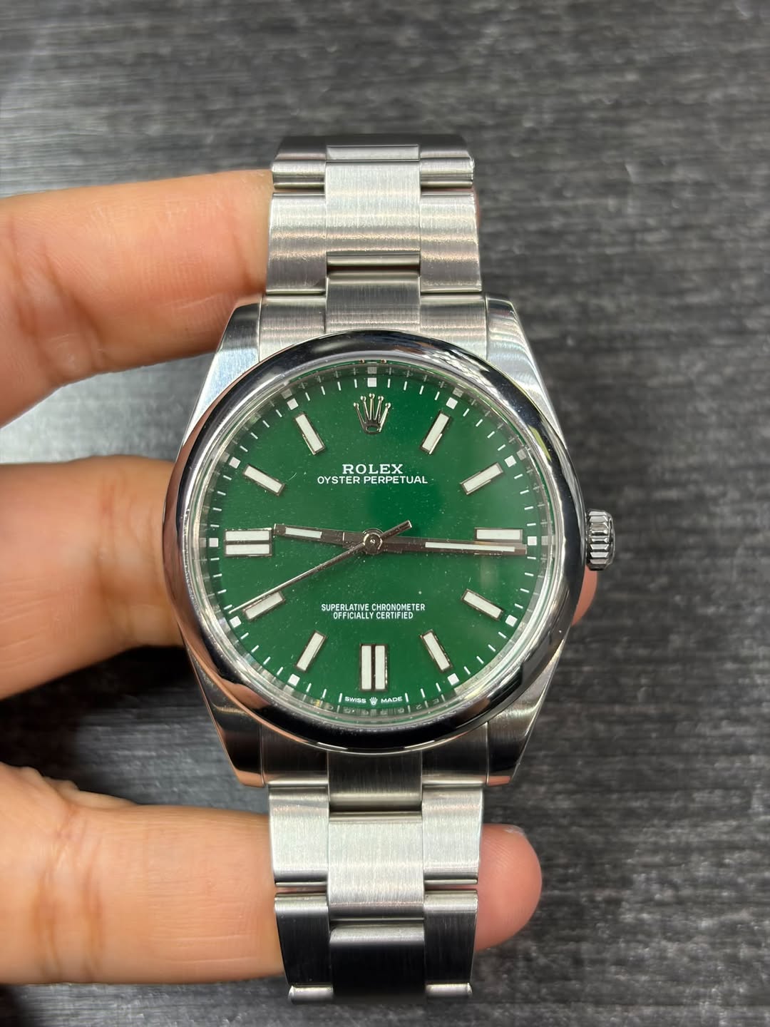 May be an image of wrist watch and text