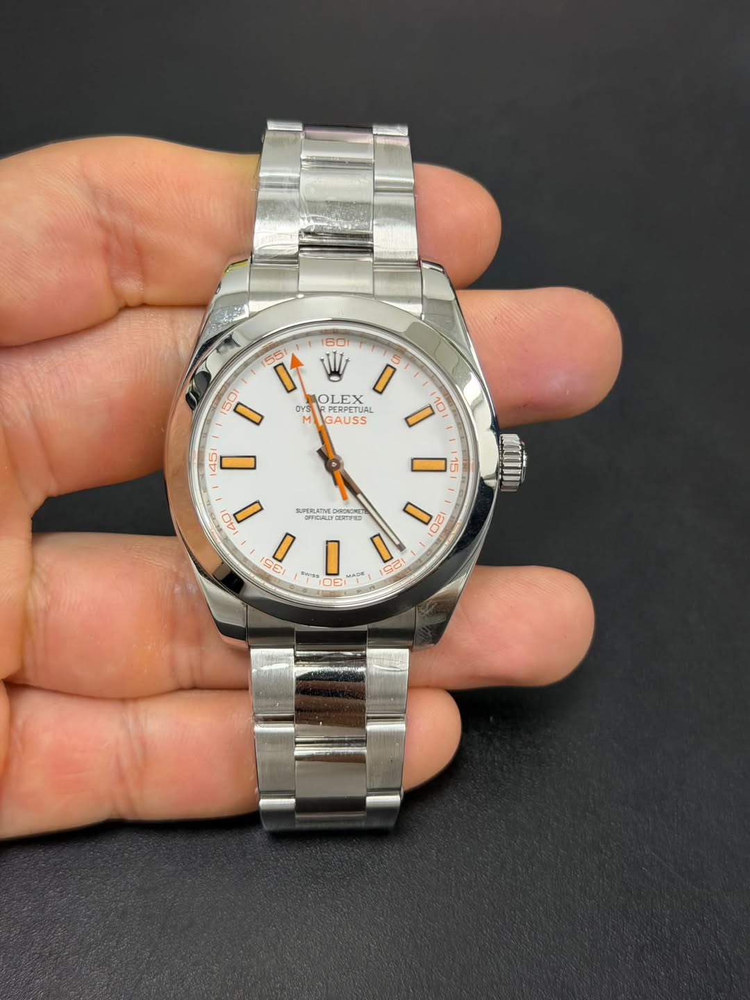 May be an image of wrist watch and text