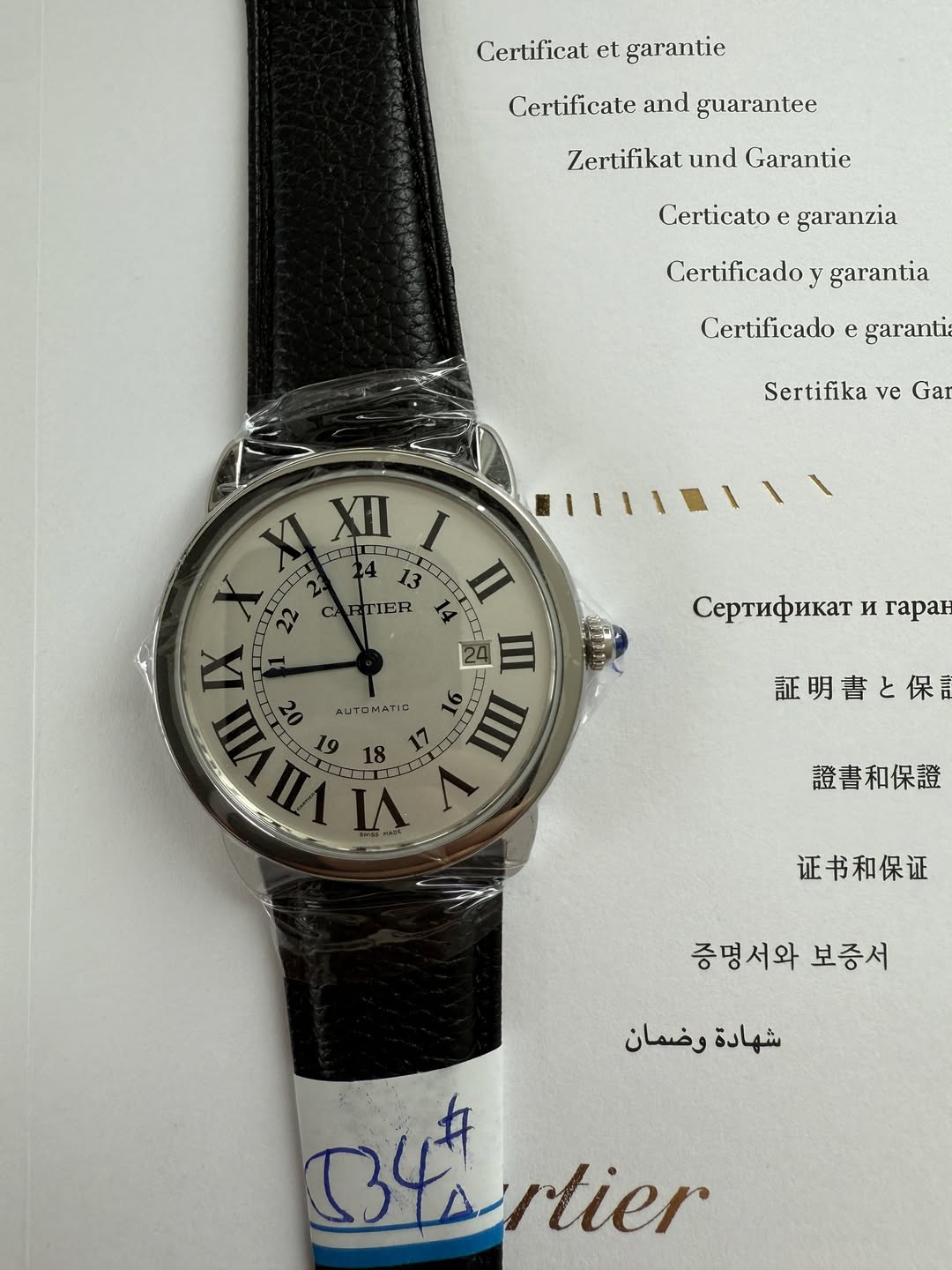 May be an image of wrist watch and text that says 'Certificat et garantie Certificate and guarantec Zertifikat und Garantie Certicato e garanzia Certificado y garantia…