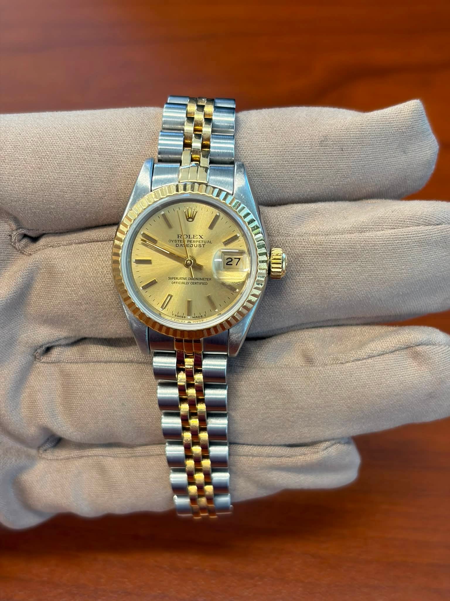 May be an image of wrist watch and text