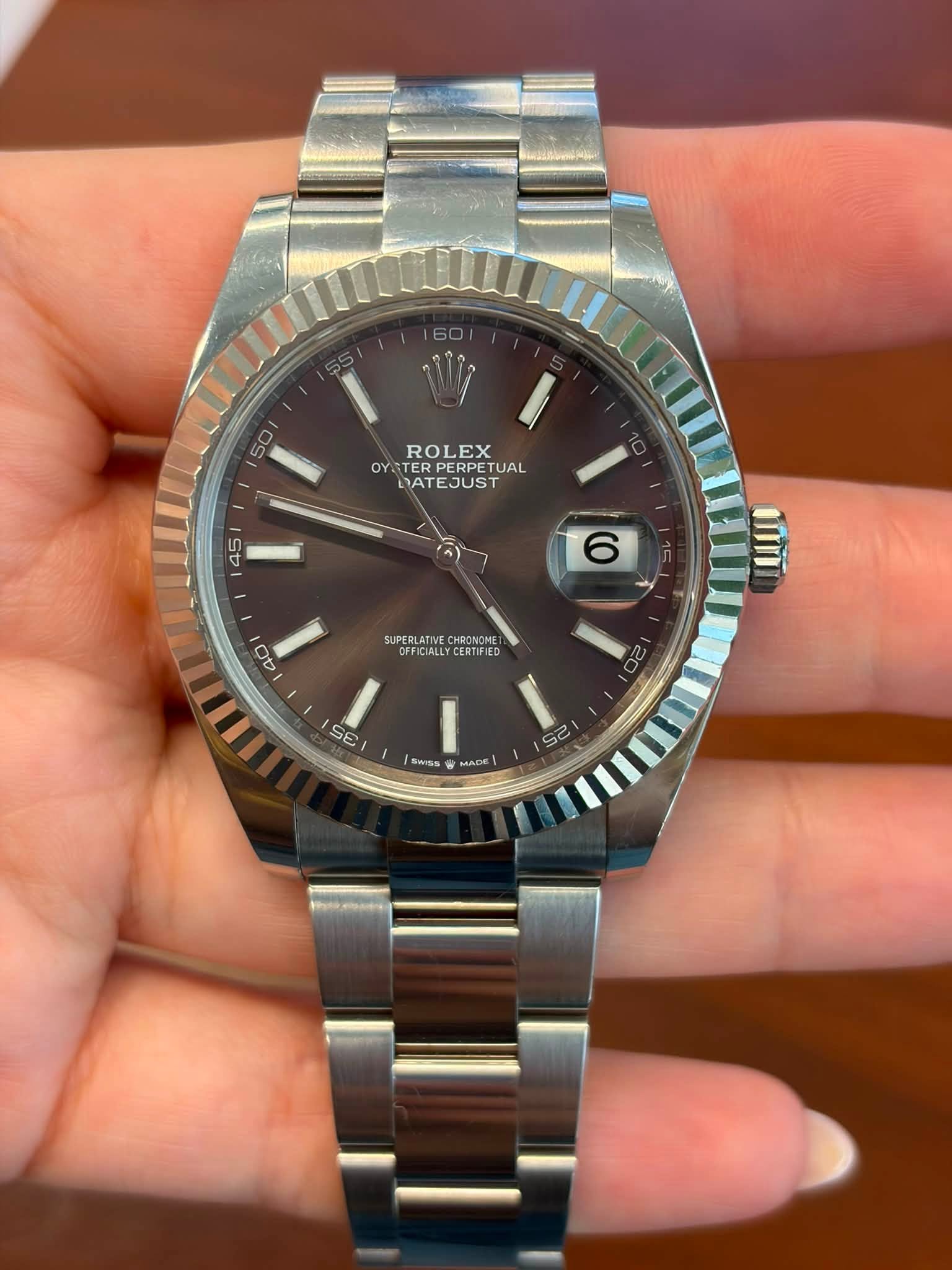May be an image of wrist watch and text that says 'L 50 ROLEX OYSTERPERPETUA OYST RPERPETUAL TUAL DATEJUST 45 6 40 SUPERLATIVE SUPERLATIVECHROV CHRONOME FFICIALLY.CERTIFIED FICIALL…