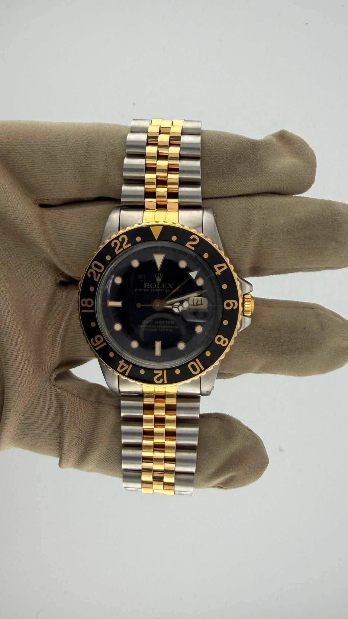 May be an image of wrist watch and text