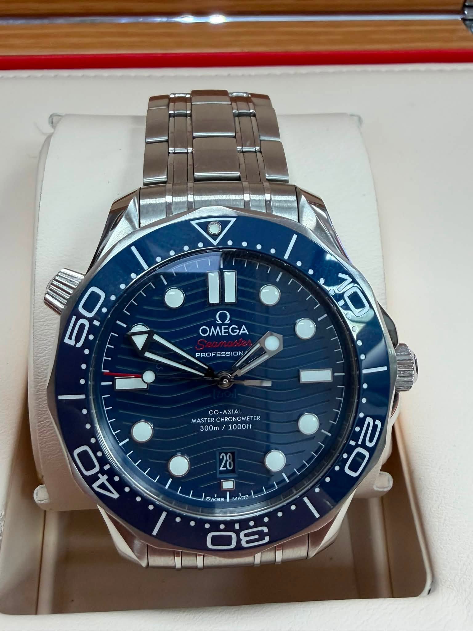 May be an image of wrist watch and text that says '50 0 5 II ع OMEGA PROFESSION PROF PROFESSION SS 10 Q-AXIAL MAST HRONOA CHRONOMETE MASTERCHRONOMETER TER E 300m 1000ft 28 ج لل…