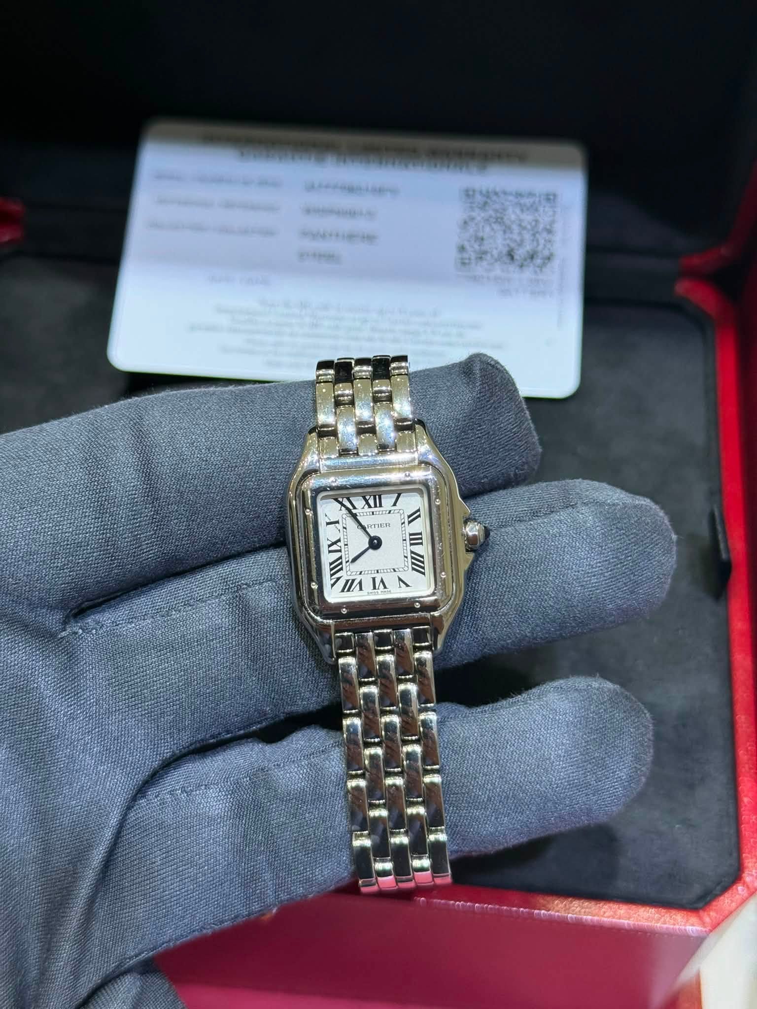 May be an image of wrist watch and text