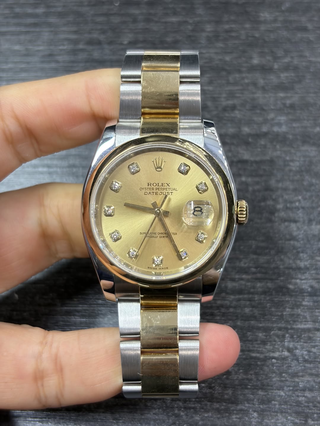 May be an image of wrist watch and text