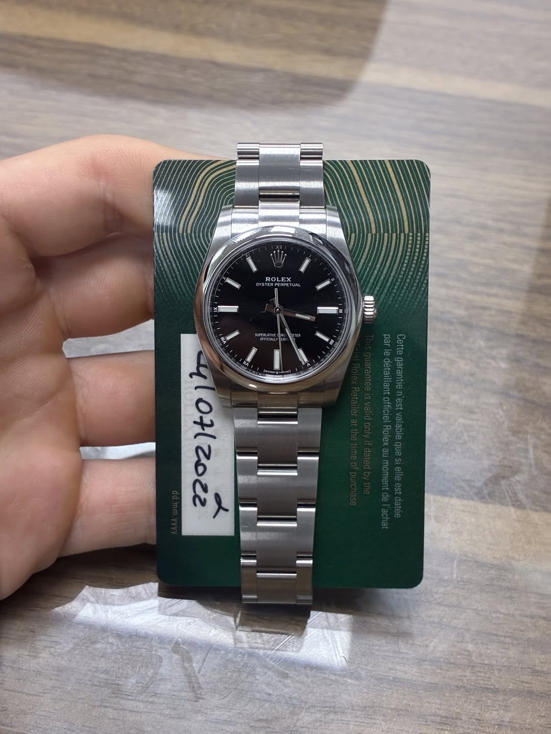 May be an image of wrist watch and text