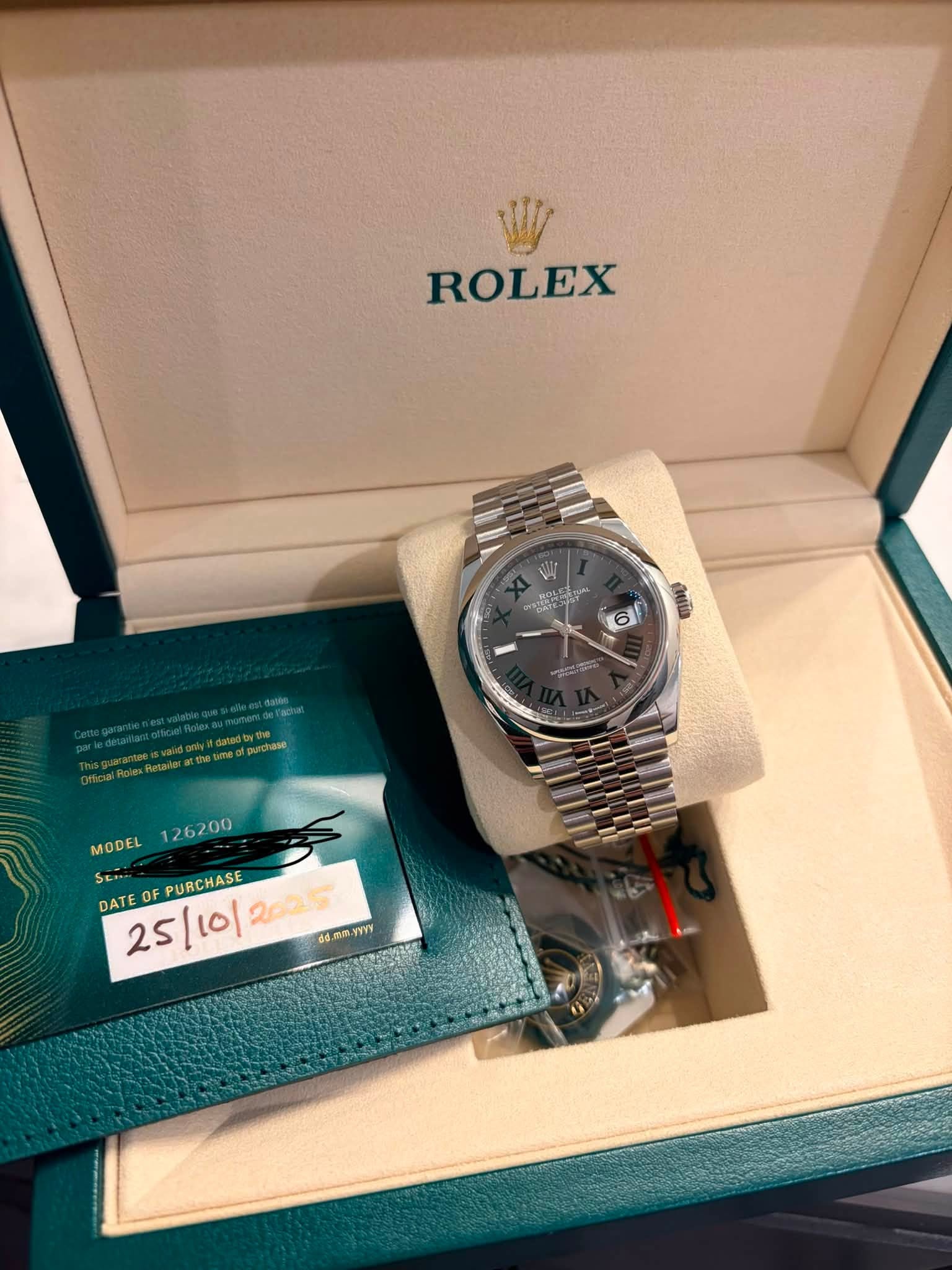 May be an image of wrist watch and text