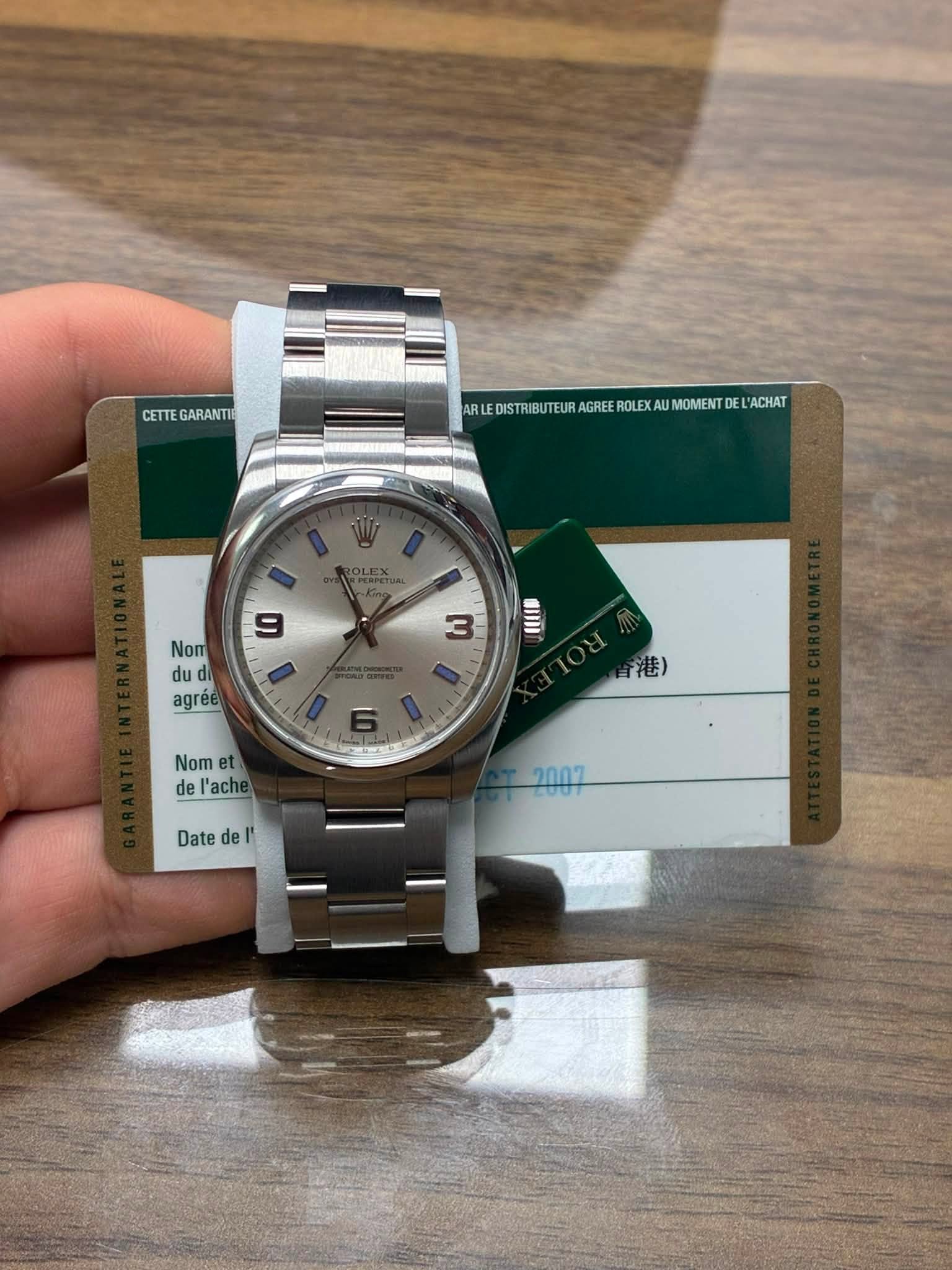 May be an image of wrist watch and text that says 'CETTE CETTEGARANTIE GARANTI MREDOSRBUTLRAOTE STRIBUTEUR AGREE ROLE MOMENT DE ACHAT 9 Nom du agréé 3 IL 港) Nom et de l'ache Date…