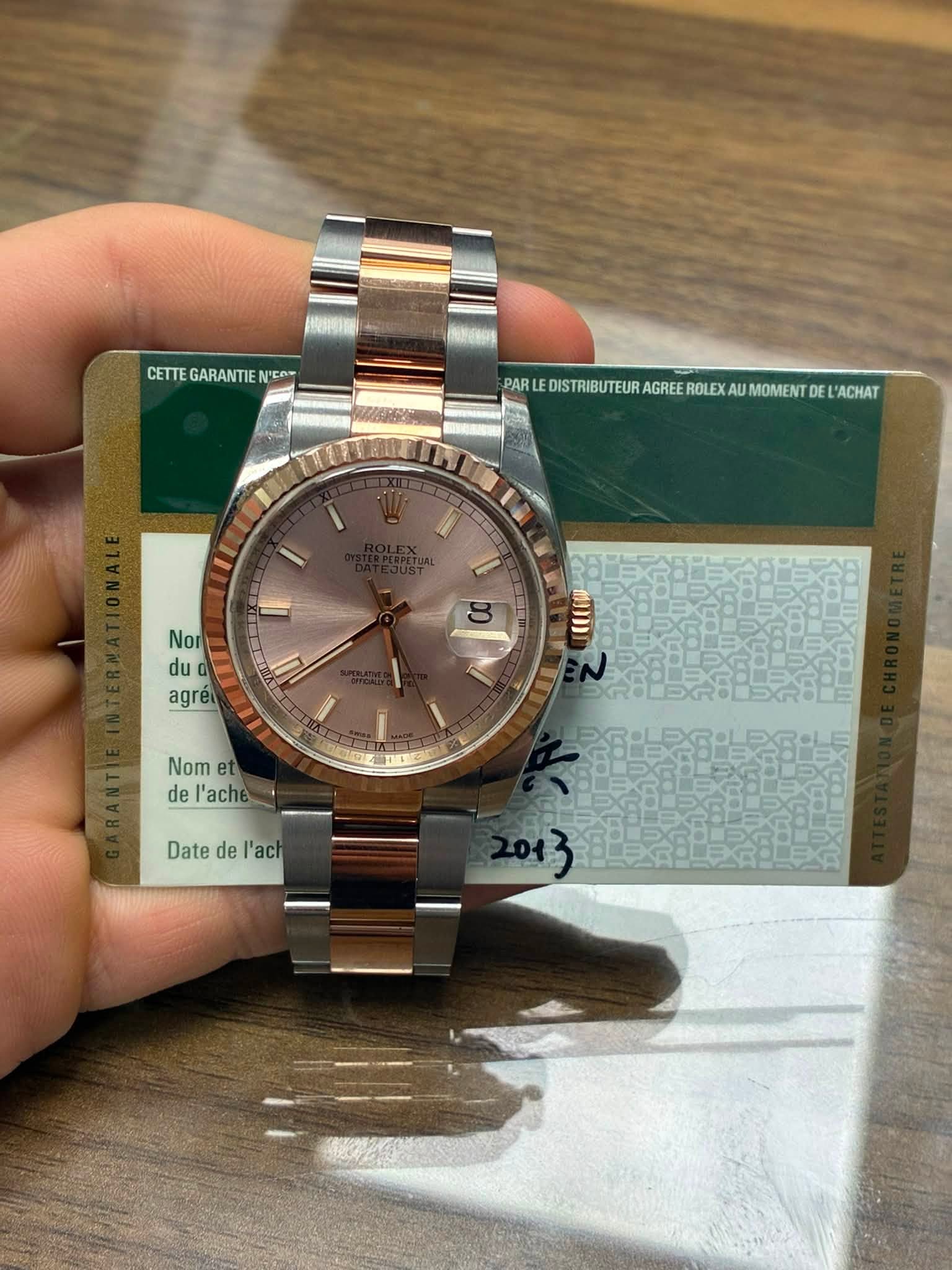 May be an image of wrist watch and text