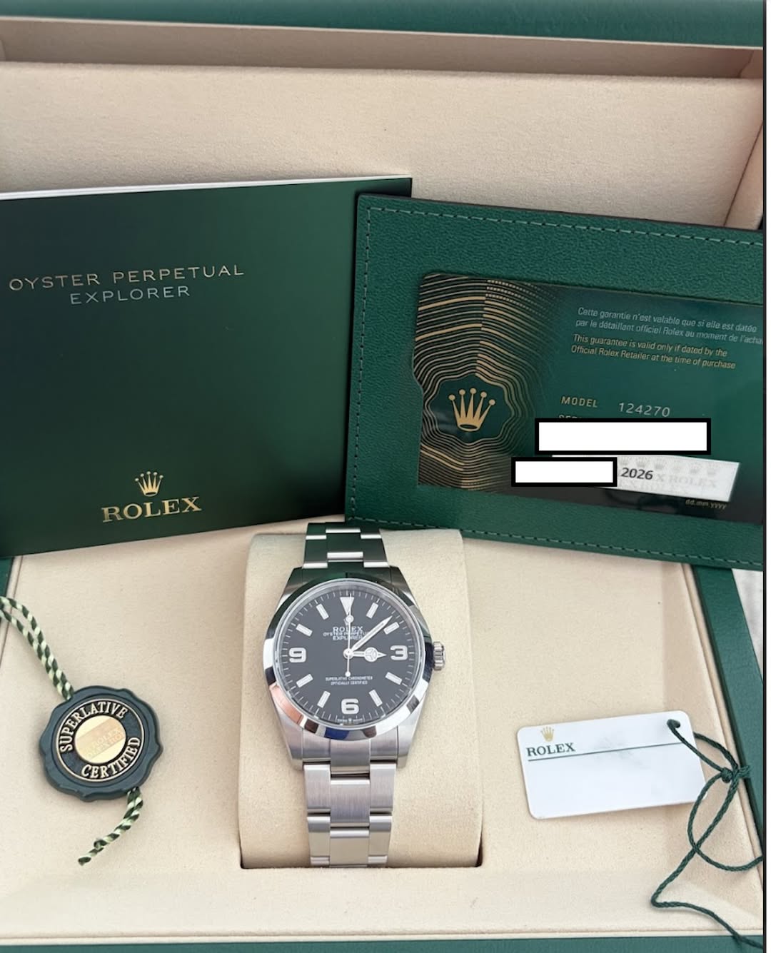 May be an image of wrist watch and text that says 'OYSTER DYSTERPERPETUAL ER PERPETUAL EXPLORER RER MODEL 124270 ROLEX 2026 몸은 EX 6 U IN 魔目 "យឈាធ 6 ETIE LATIVE CERIEND CER ERTIE…