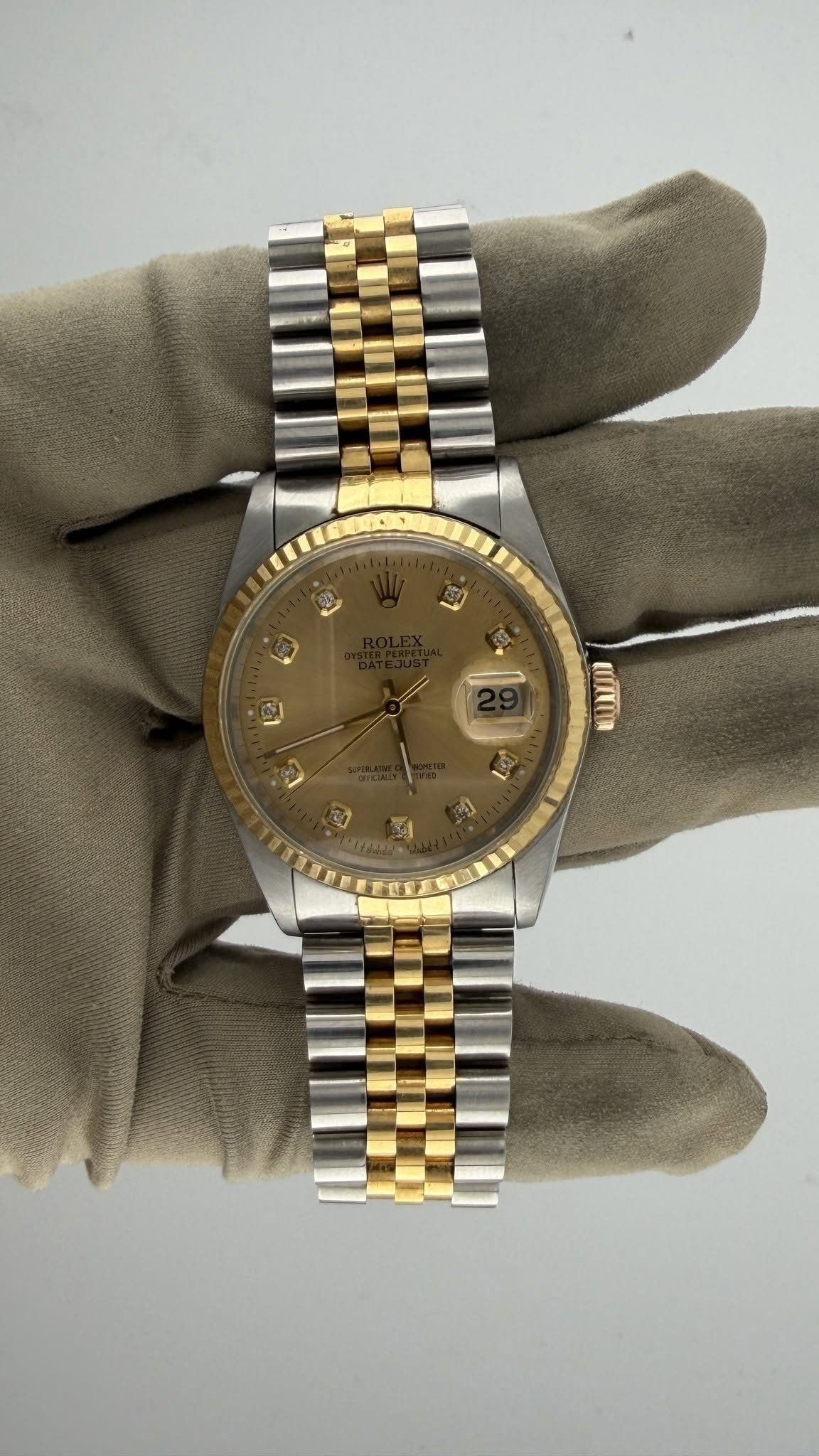 May be an image of wrist watch and text