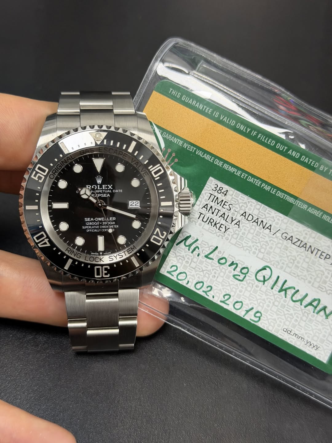 May be an image of wrist watch and text that says 'THIS GUARANTEEIS VALID ONLY IF FILLED OUT AND DATED BY 50 ROLEX DATE FRPETUA EXPSEA PSEA 10 22 SEA DWEI LER METER EDCHLLYGERT…