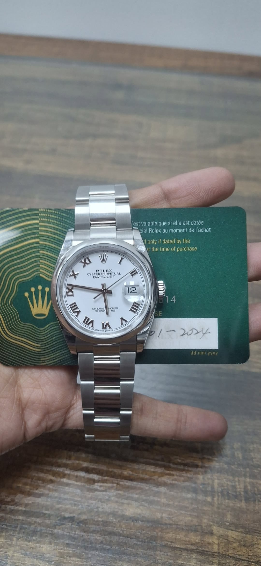 May be an image of wrist watch and text