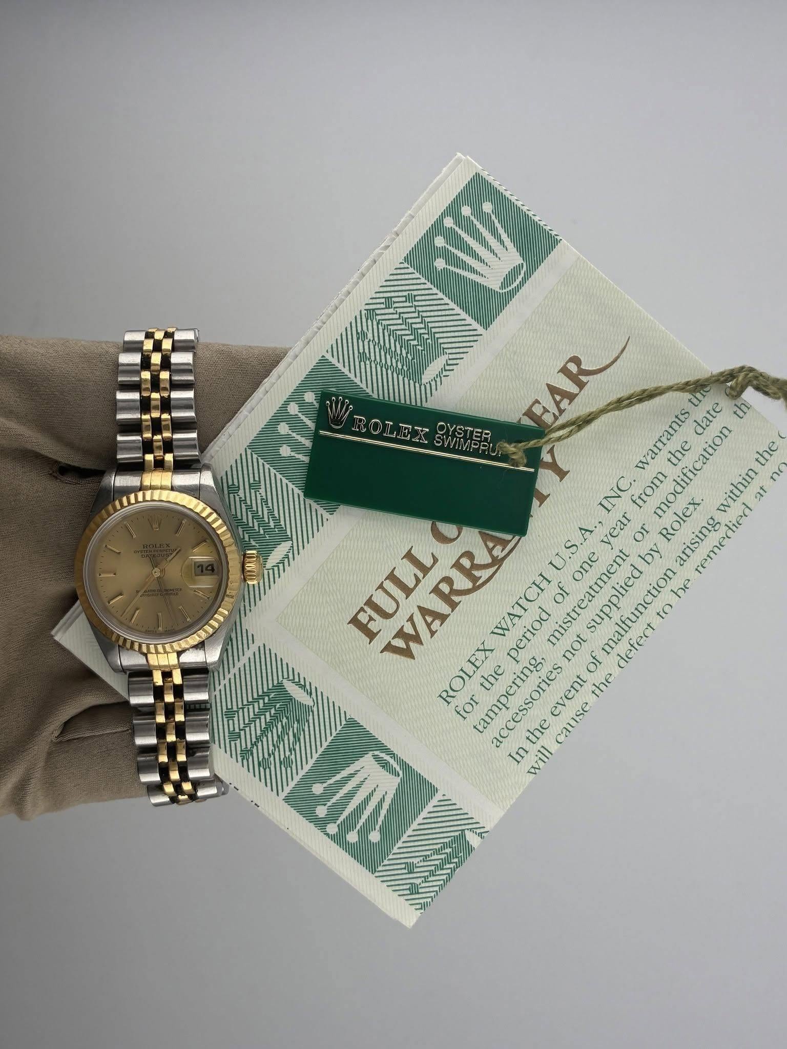 May be an image of wrist watch and text that says 'EAR warrants the date th the the INC. from FULL WARRA S. ya yeM or Rolex. modification within U arising Tep remertied within no…