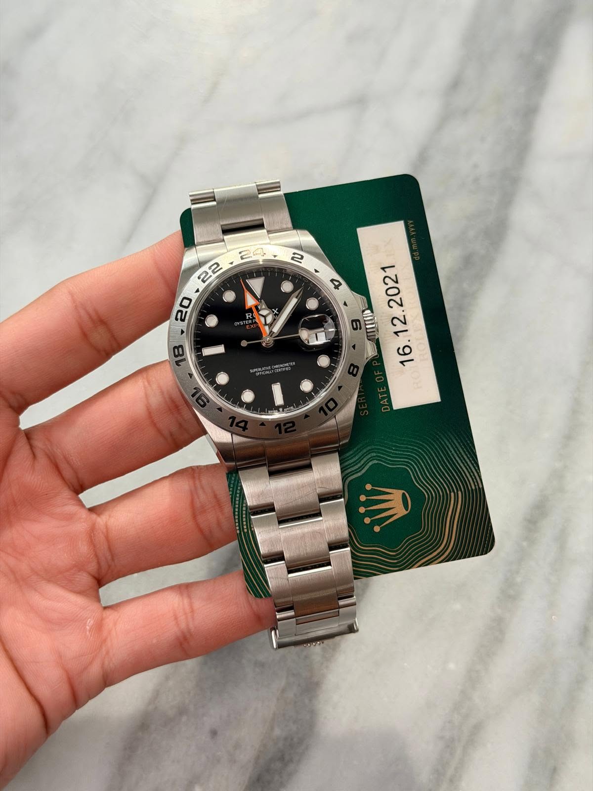 May be an image of wrist watch and text