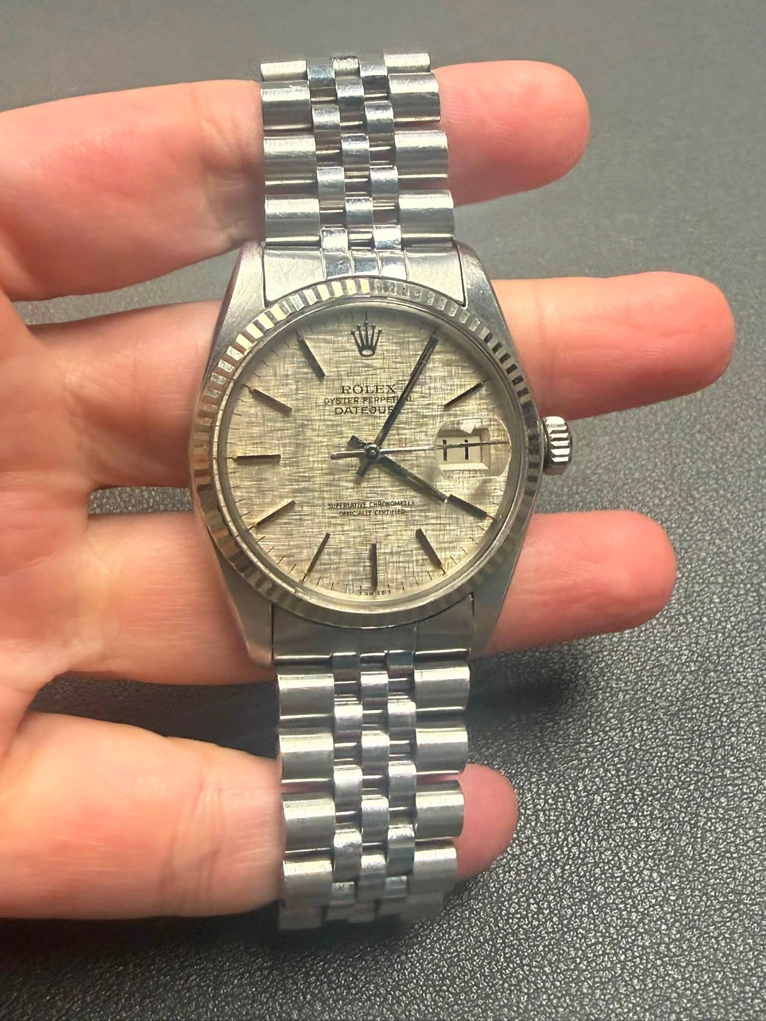 May be an image of wrist watch and text