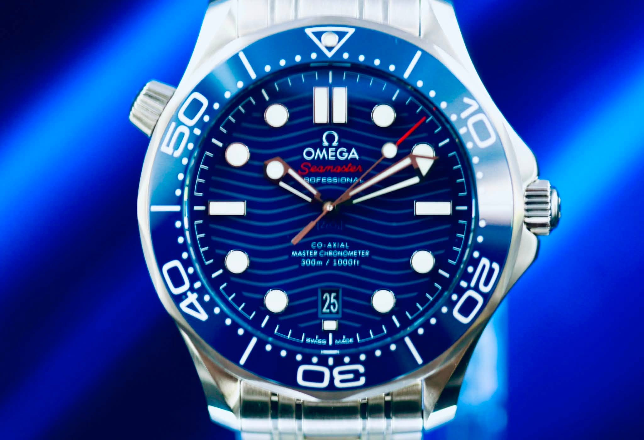 May be an image of wrist watch and text that says 'D. Il OMEGA ח OMEGA ROFESSIONA 10 co AXIAL MASTER CHRONOME MASTERCHBONOMETE EM 300m 1000ff 0ز ن လ 25 ό 冰 O SwSs AKИ'