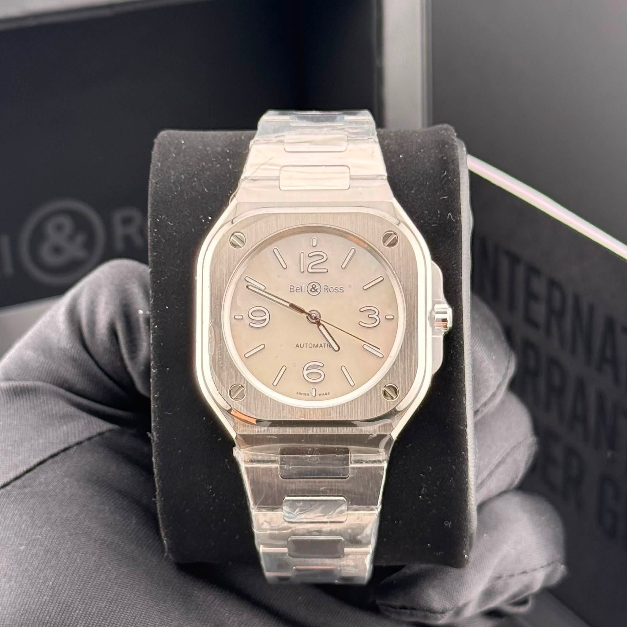 May be an image of wrist watch and text
