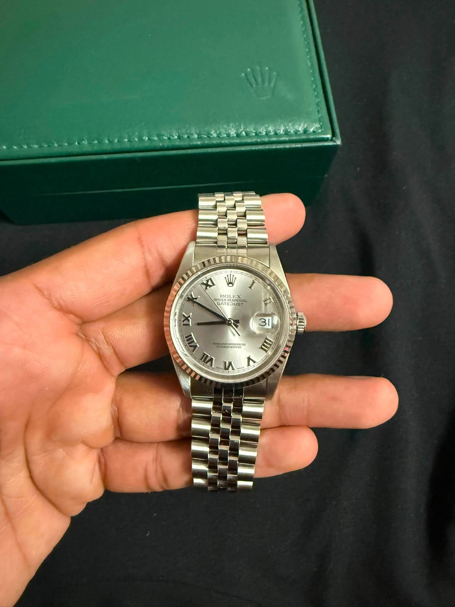May be an image of wrist watch and text