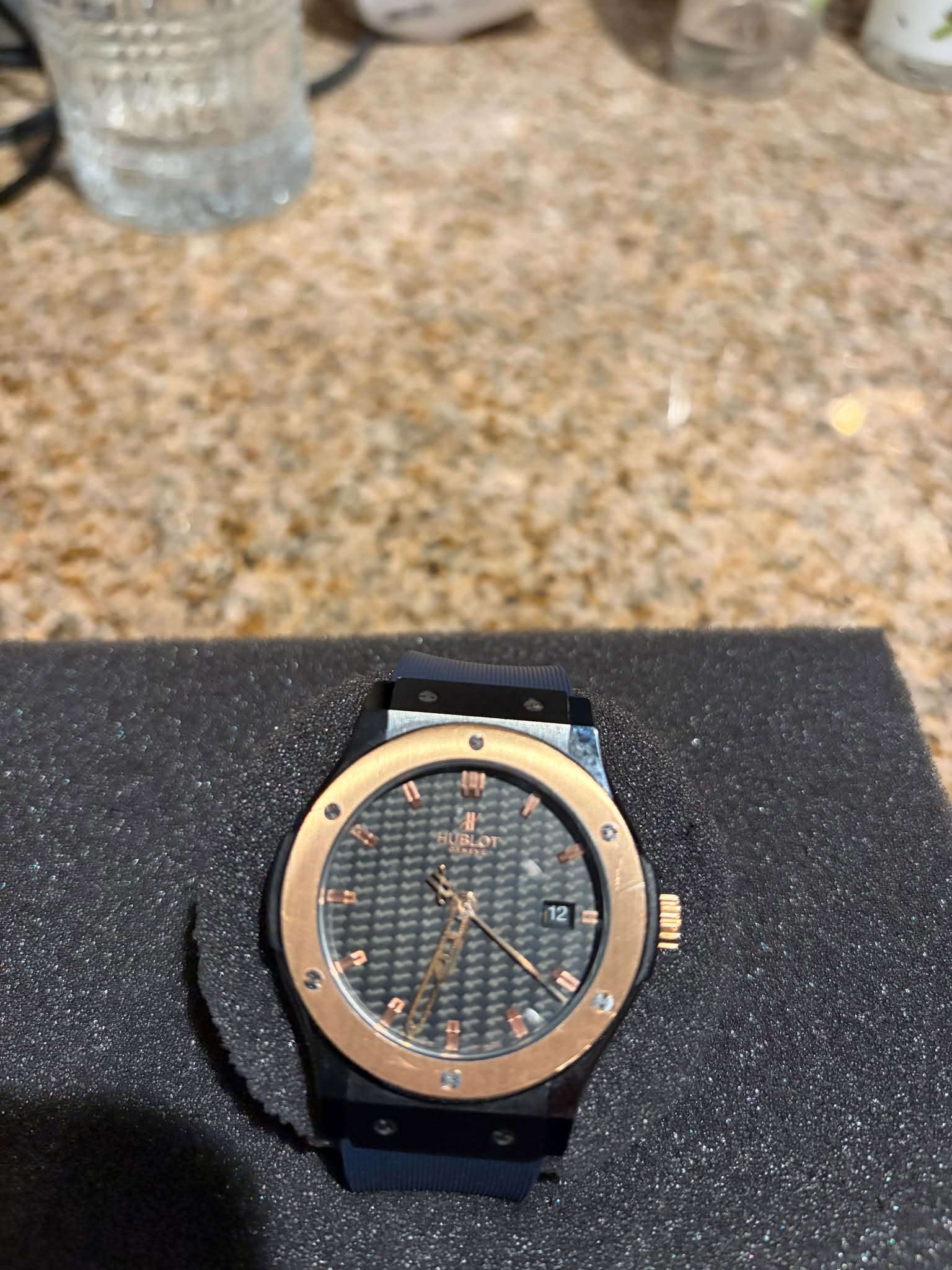 May be an image of wrist watch and text