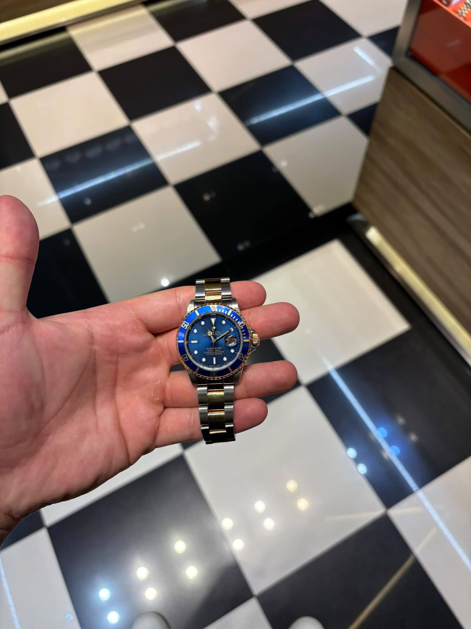 May be an image of wrist watch and text