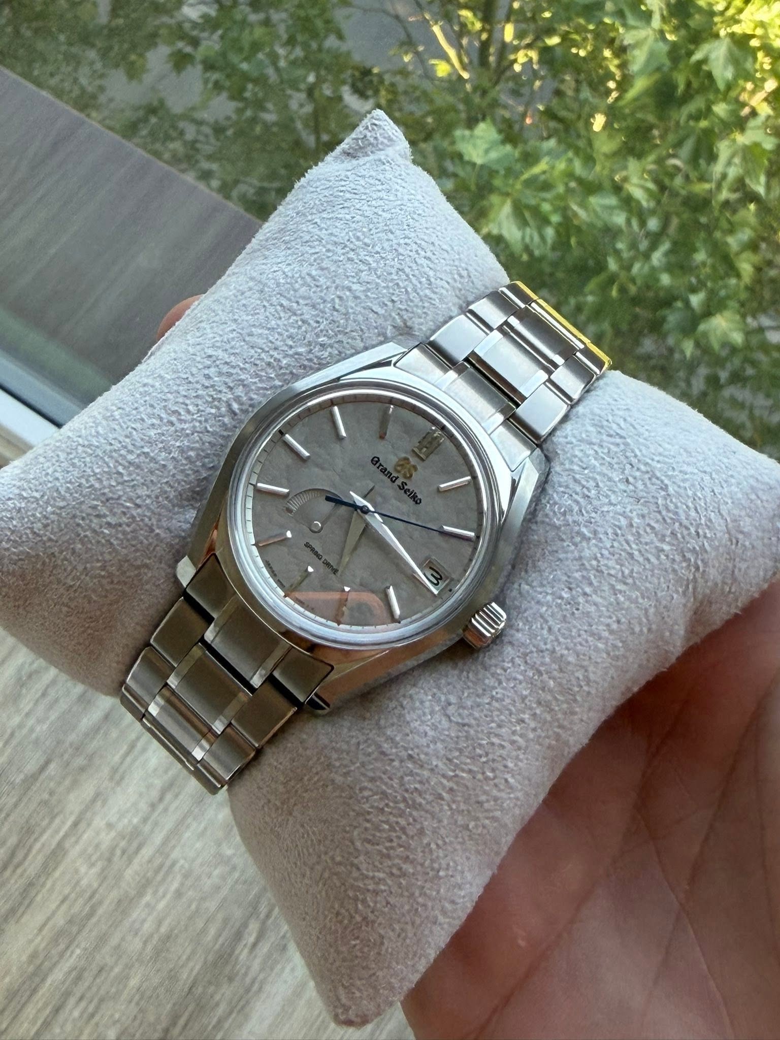 May be an image of wrist watch and text