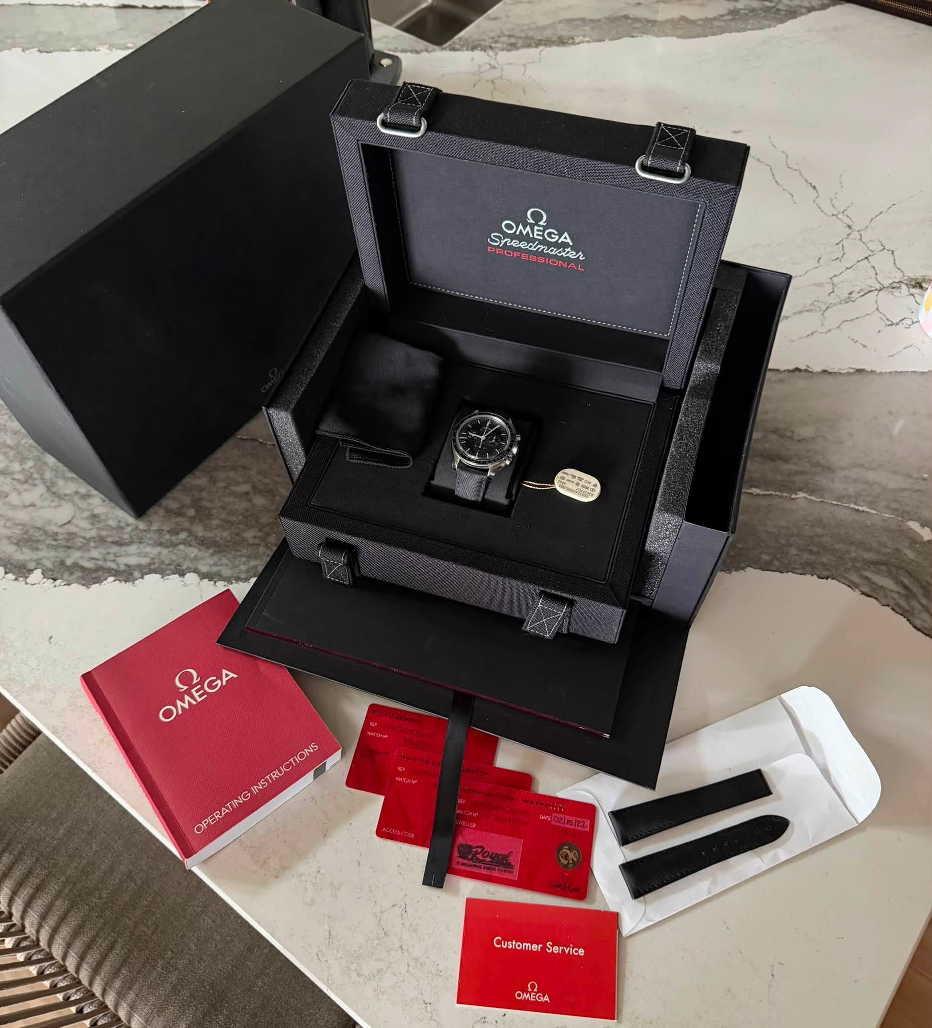 May be an image of wrist watch and text that says 'Sneedmader cлeecTeB SOMEGA Speed OMEGA CMEGA Sneedmast SHEA OMEGA INGINST IN INSTRUCTIONS VST OPERATIN Customer CustomerServic…