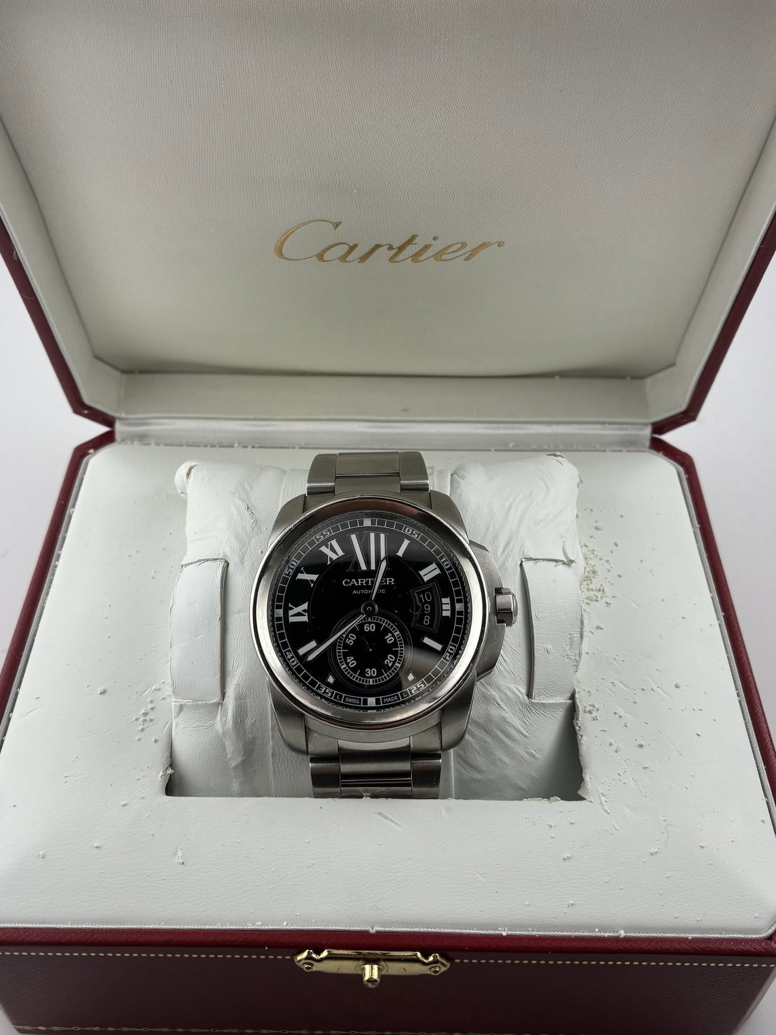 May be an image of wrist watch and text