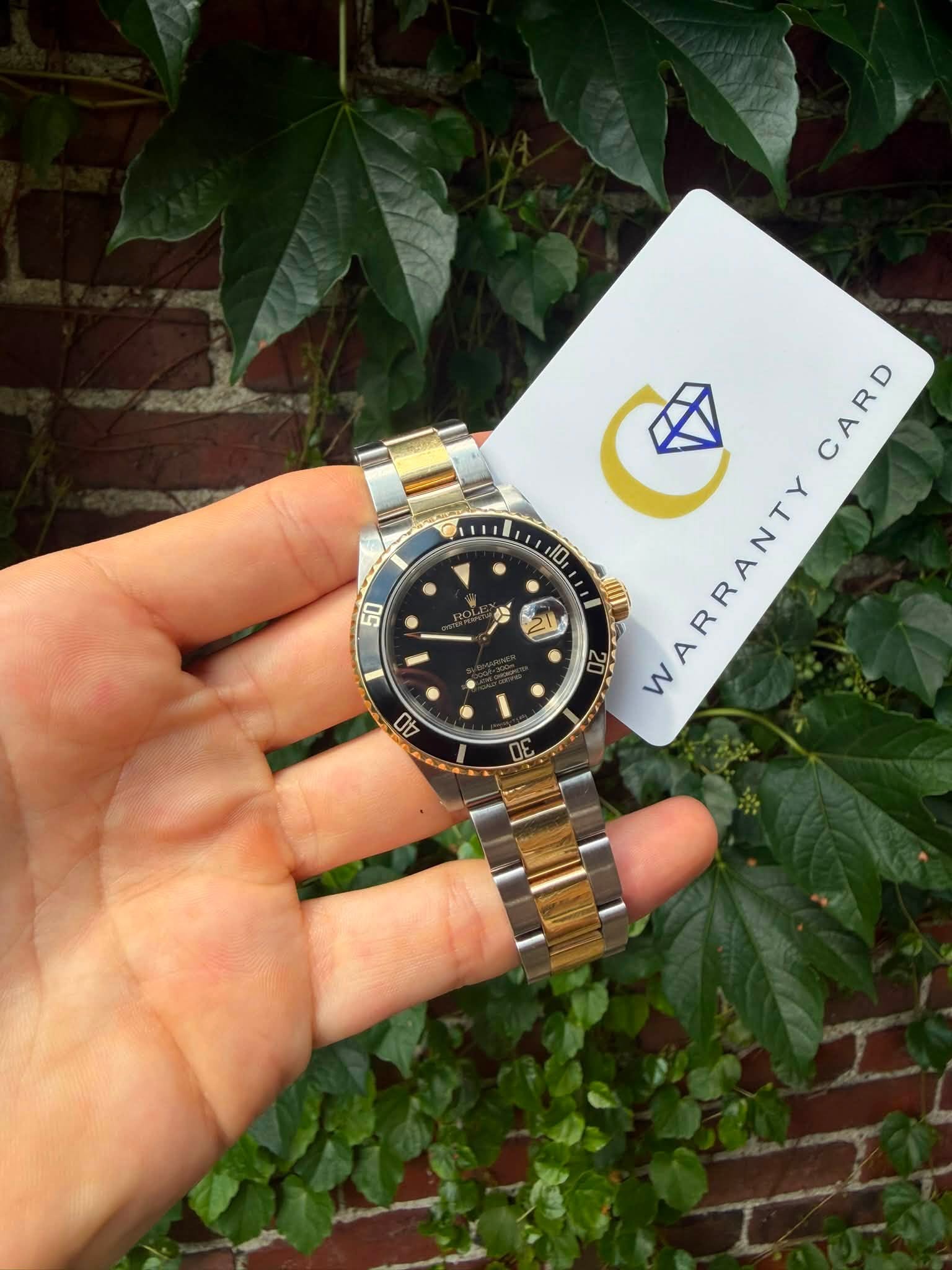 May be an image of wrist watch and text that says '50 8 ে হ CARD CARD 10 20 WARRAN WARRANTY w 10'
