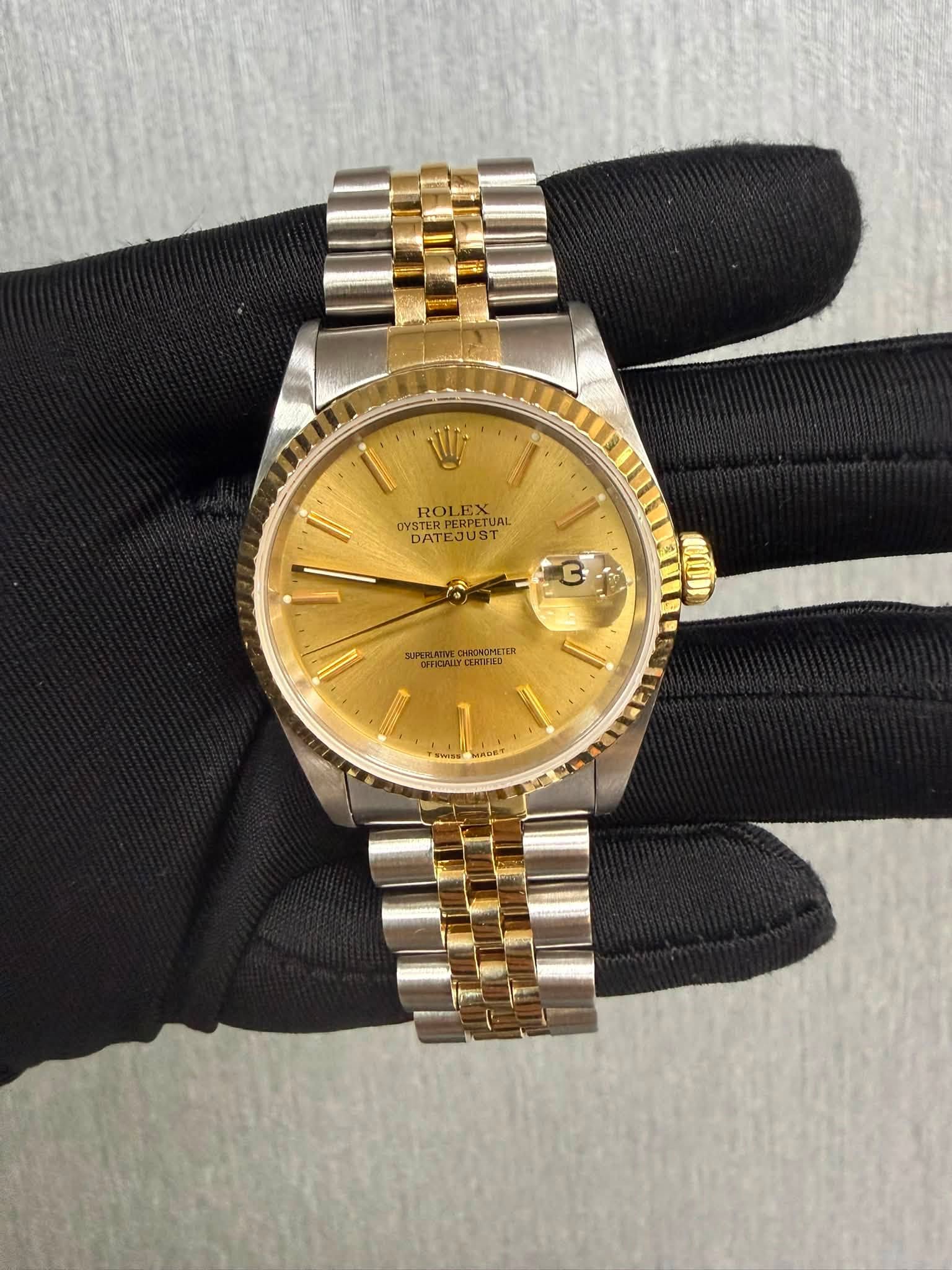 May be an image of wrist watch and text