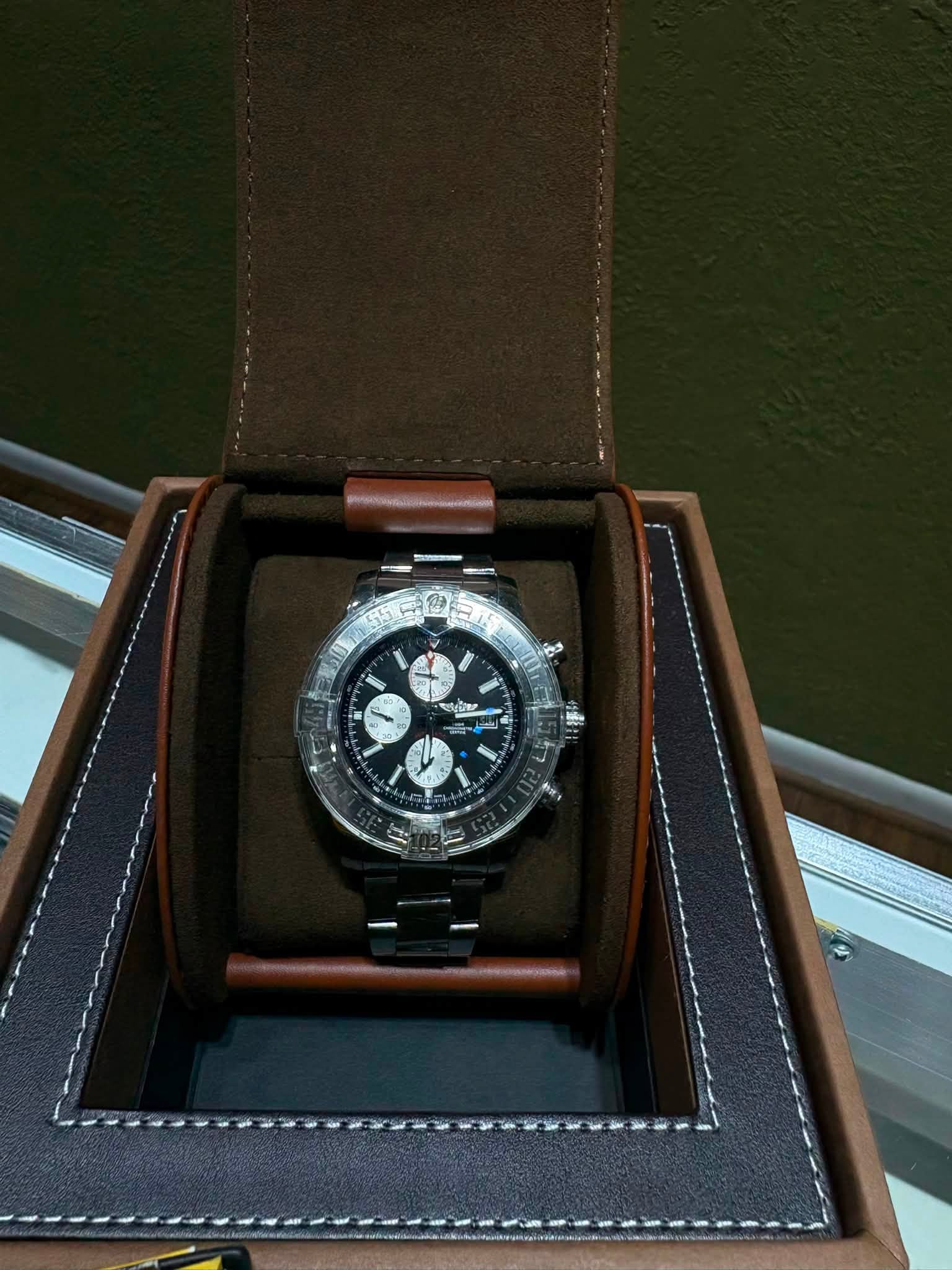 May be an image of wrist watch and text