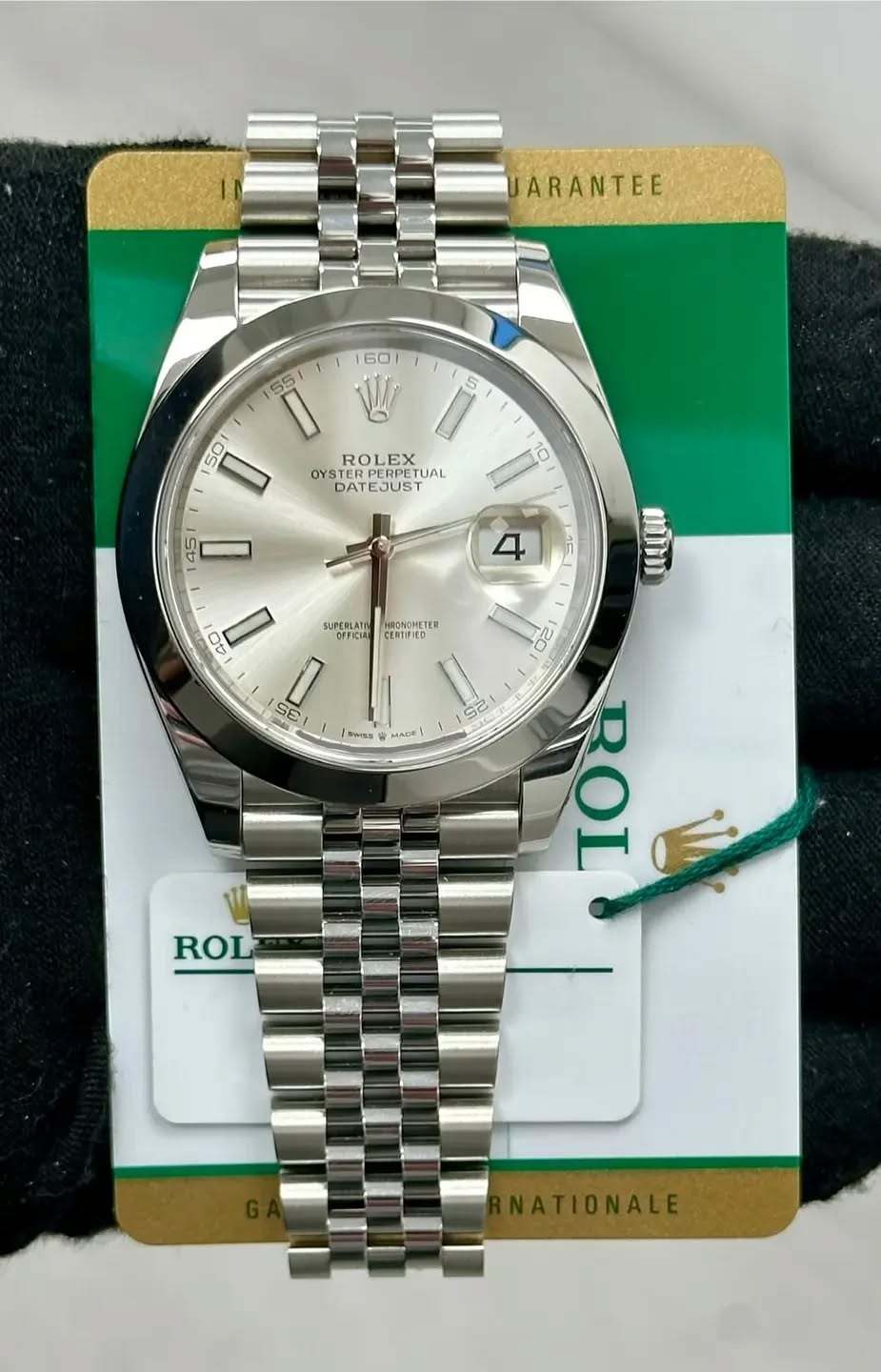 May be an image of wrist watch and text that says 'ARANTEE 60 55 5 ROLEX OYSTER STERPERPE OYSTERPERPETUAL UAL DATEJUS 10 50 D 45 D 4 1F SUPERLATE OFFICIRE 40 HRONGHETER HETER…