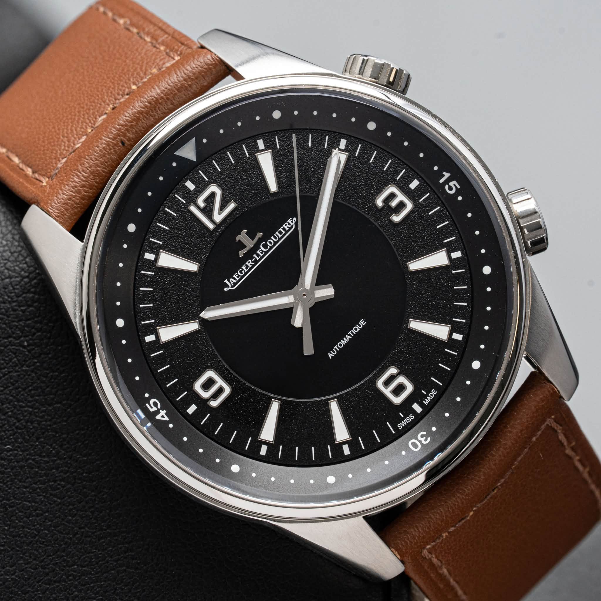 May be an image of wrist watch and text that says '15 ጦ 12 JAEGER-LECOULIRE ECOULTRE JAEGER-L AUTOMATIQUE 6 I MADE MADE SWISS O0 θεν 45 5 መ'