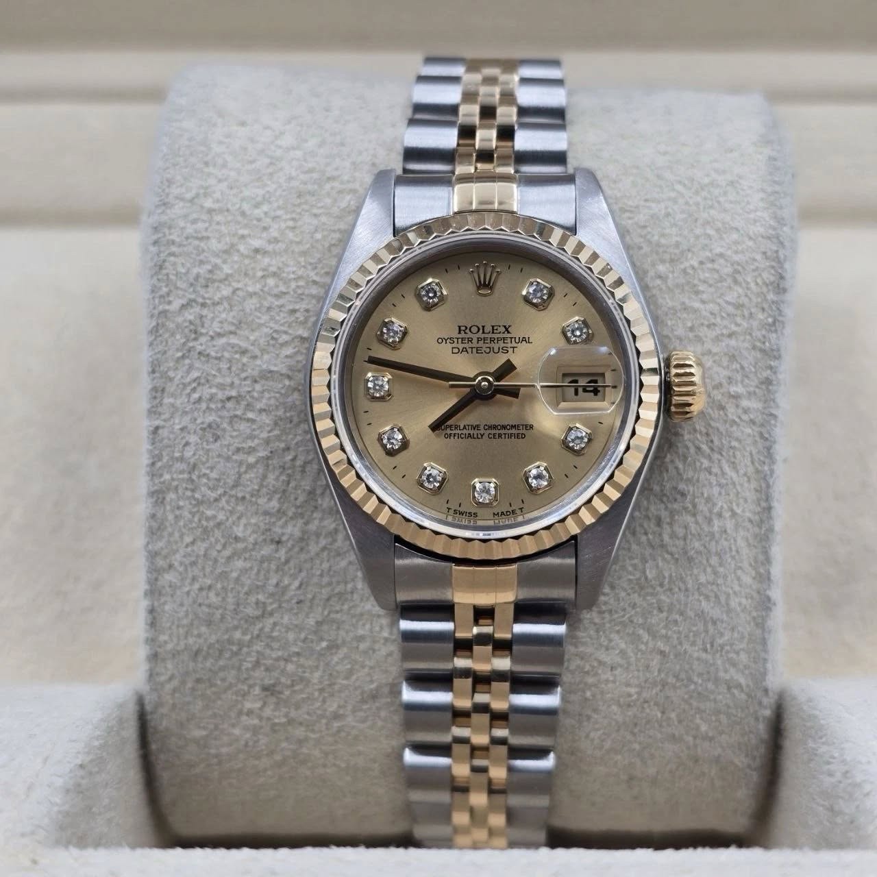 May be an image of wrist watch and text