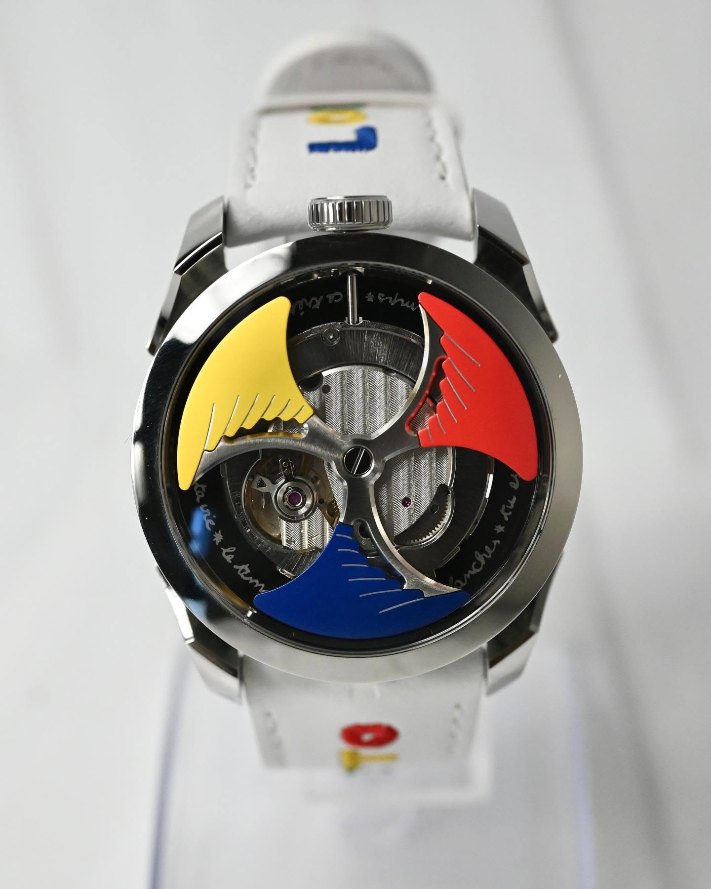 May be an image of wrist watch and text