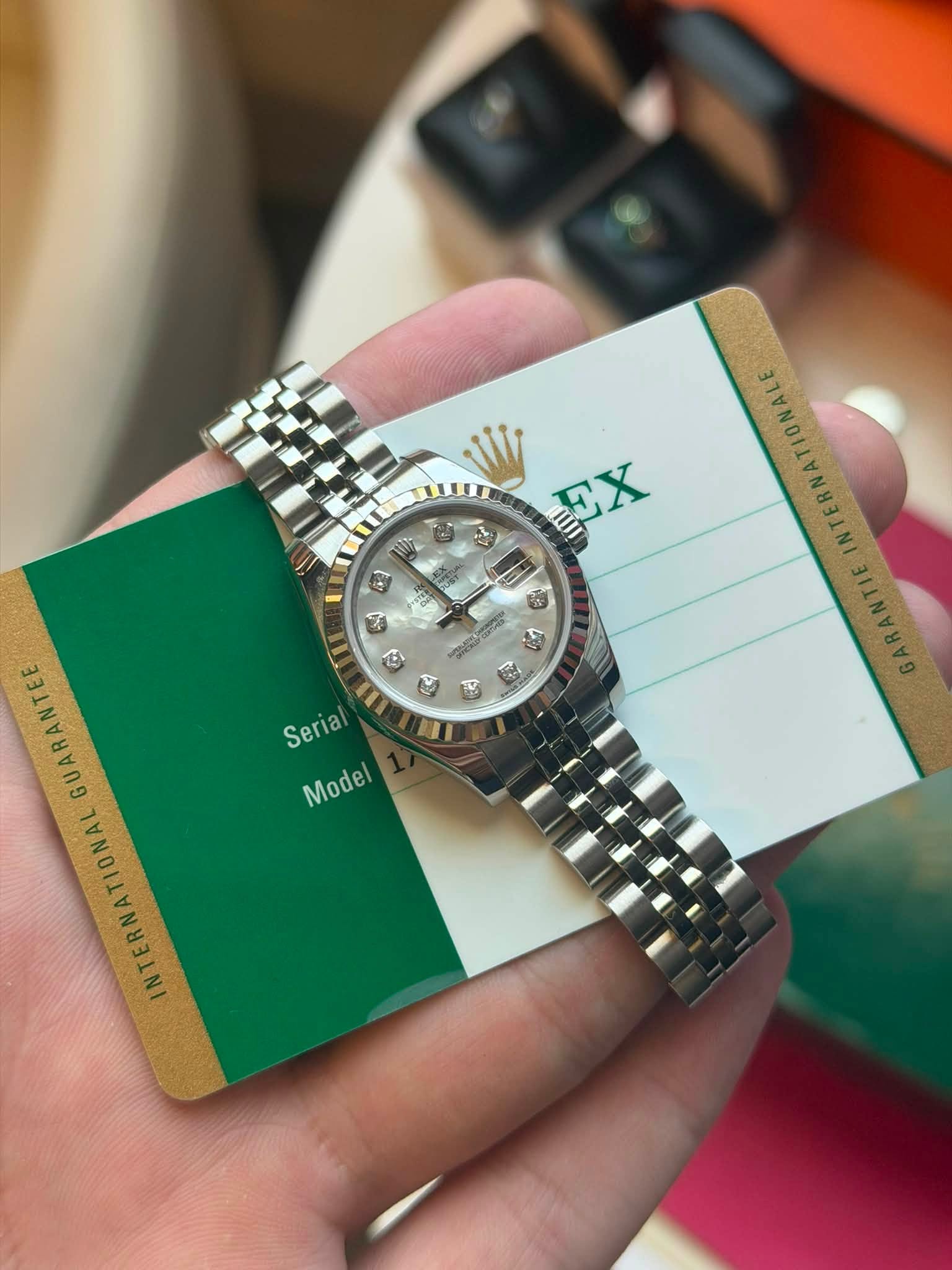 May be an image of wrist watch and text that says 'ॐ σ R N0X 7 Seria Mode GUARANTE INTERNATIONA TIONAL INTERNA'